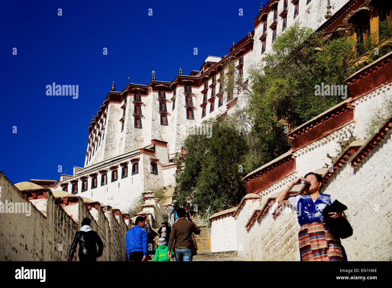 LHASA, TIBET, CHINA OCTOBER 20 Tibetans climb the stairs leading to