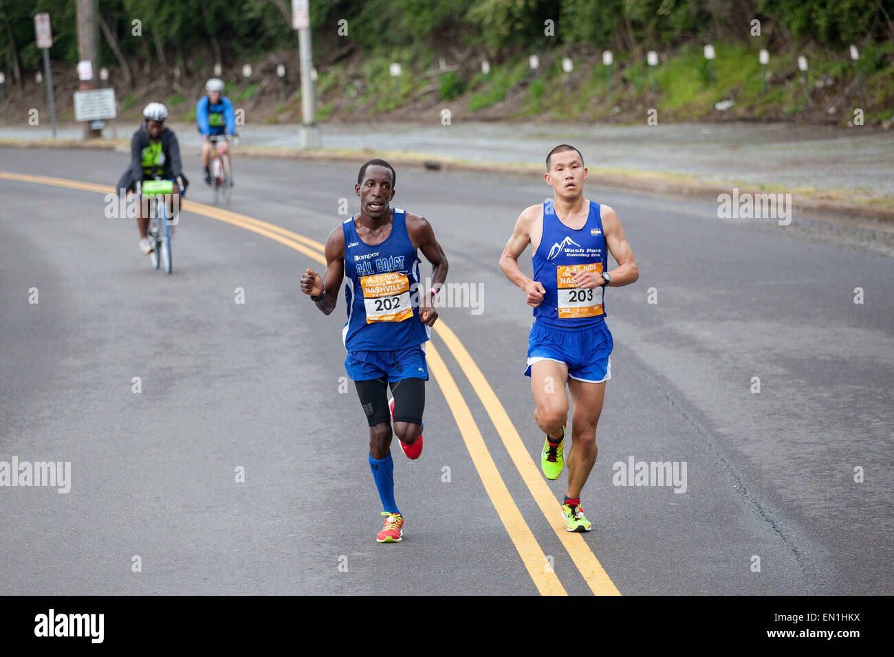 Nashville, Tennessee, USA. 25th Apr, 2015. STEVE CHU (right, bib number 203) and ROOSEVELT COOK (left, bib number 202) compete during the final stretch of the St. Jude Country Music Half Marathon. © Raffe Lazarian/ZUMA Wire/ZUMAPRESS.com/Alamy Live News Stock Photo