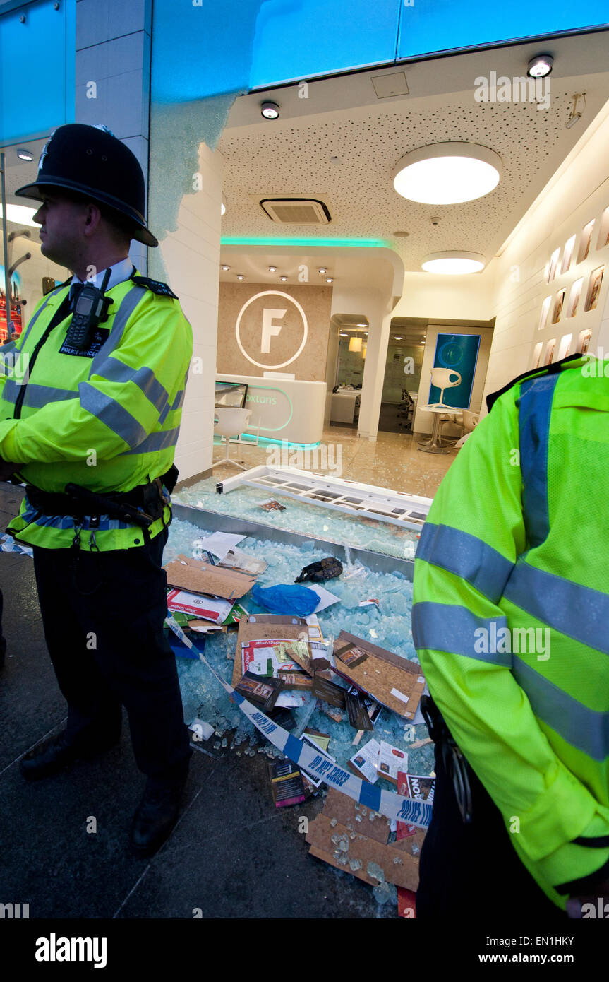 Foxtons Estate Agents window smashed and riot police using tear gas