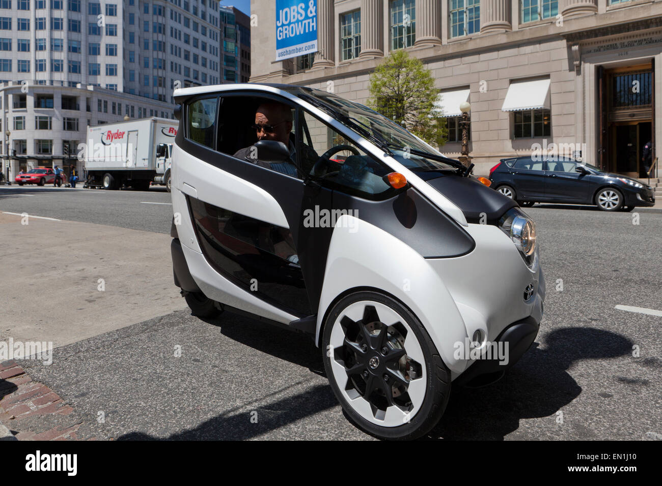 Toyota i-Road concept car (3 wheeled EV) on road - Washington, DC USA Stock Photo