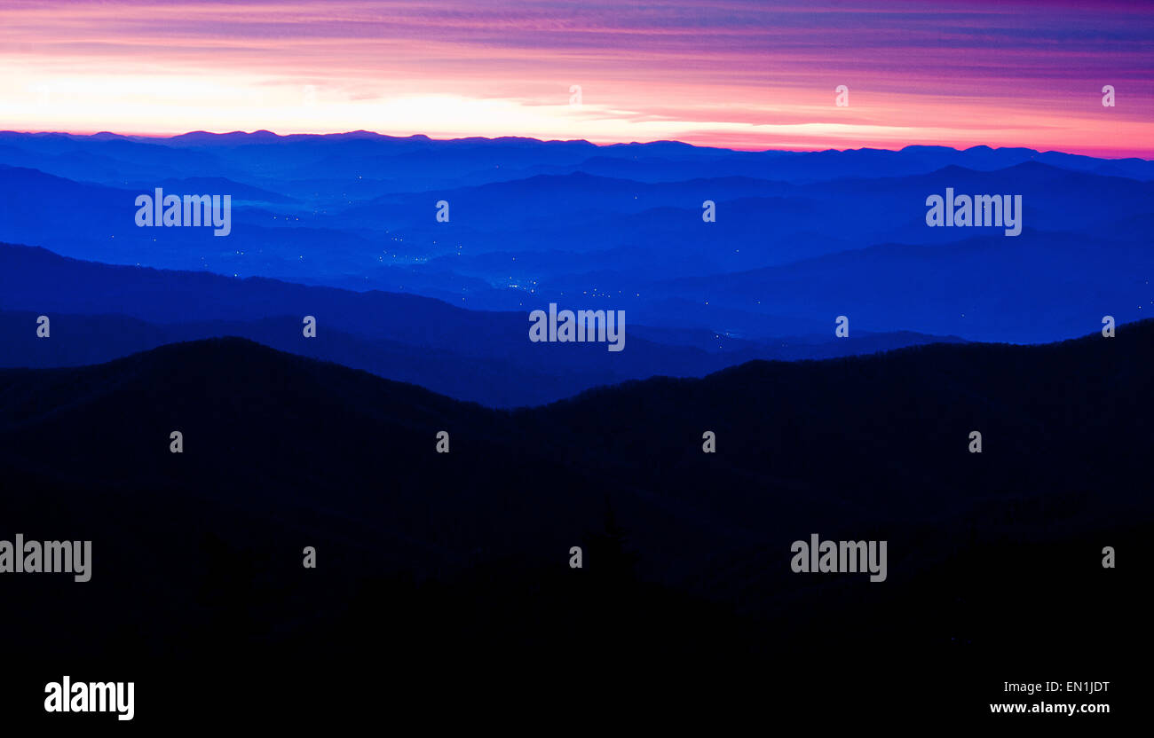 City Lights twinkle  below the Appalachian Mountains during sunrise. Stock Photo