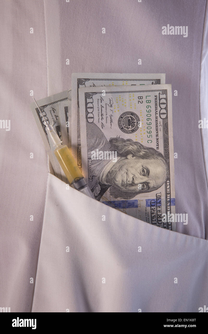 Syringe and cash money in pocket of laboratory coat Stock Photo