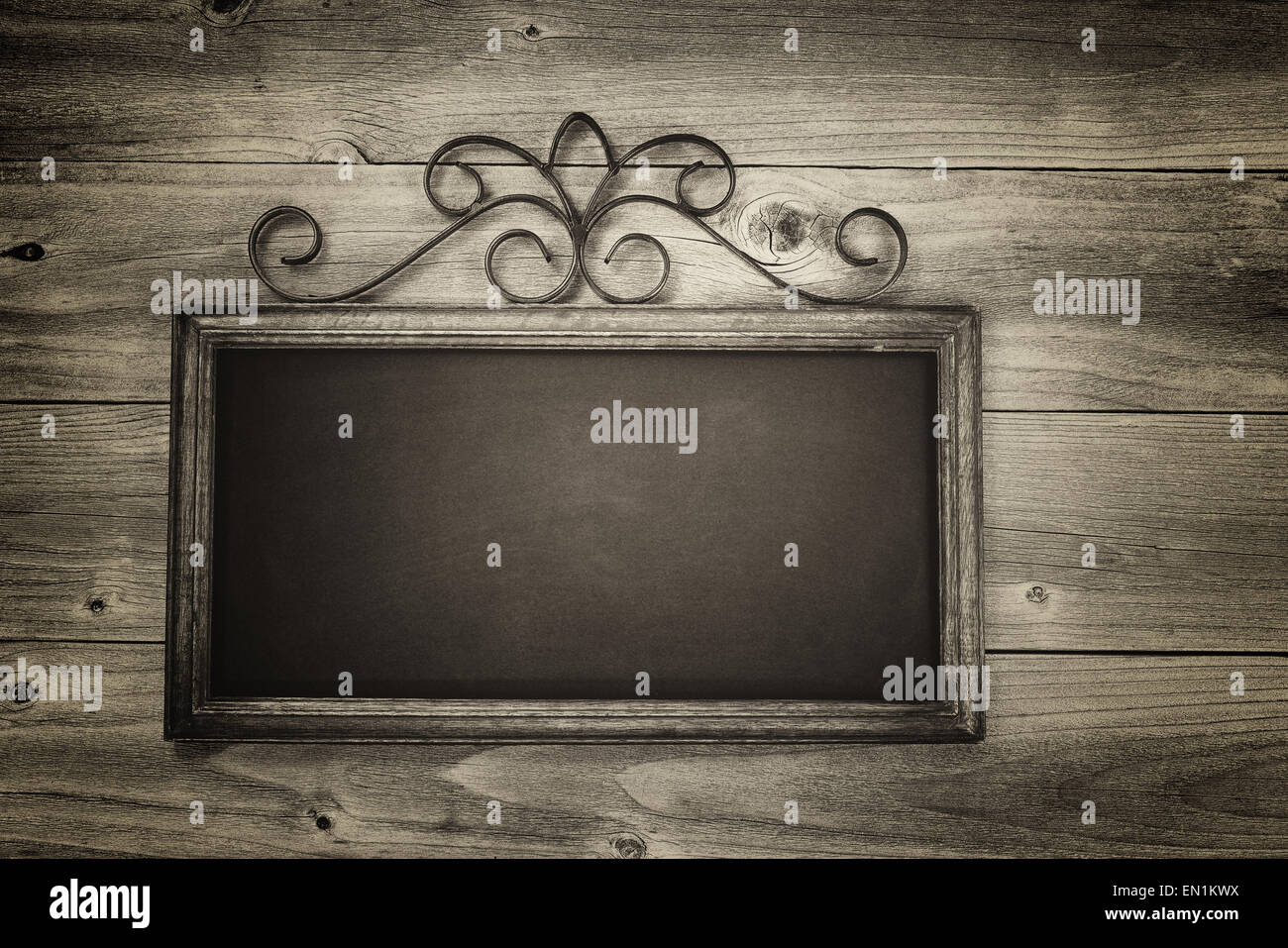 Vintage concept of a chalkboard on rustic wood. Layout in horizontal format. Stock Photo