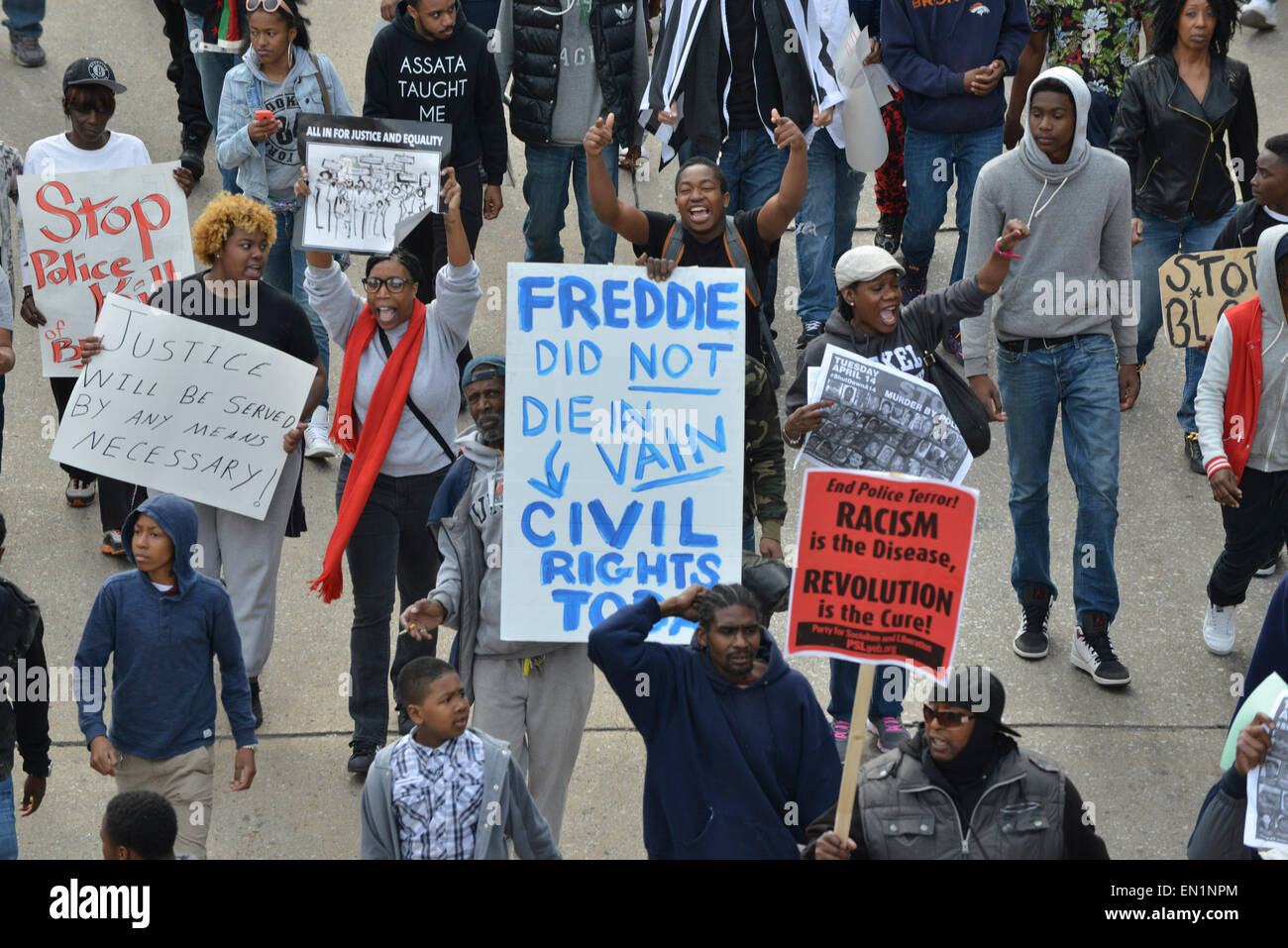 Baltimore, MD, USA. 25th Apr, 2015. Protesters march through downtown Baltimore in a demonstration against police brutality in the city. The demonstrations were sparked by the death of Freddie Gray, who suffered an as-yet unexplained but fatal broken neck and crushed larynx after being arrested by Baltimore police officers. Credit:  Jay Mallin/ZUMA Wire/Alamy Live News Stock Photo