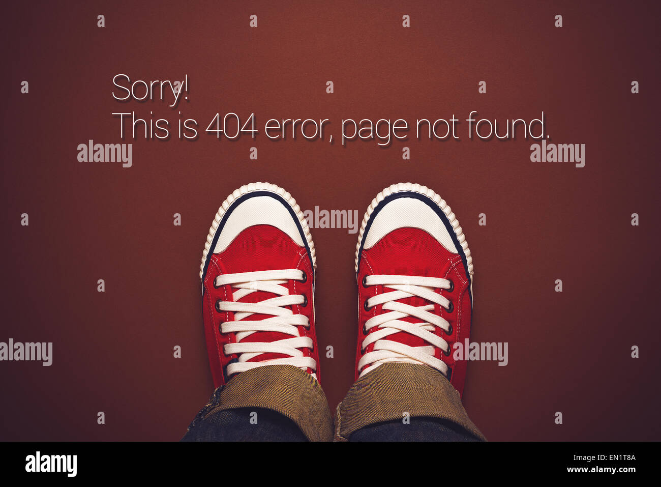 Top View of 404 Error, Page Not Found, Person in Red Sneakers Standing on Brown Background with Internet Error Message Stock Photo
