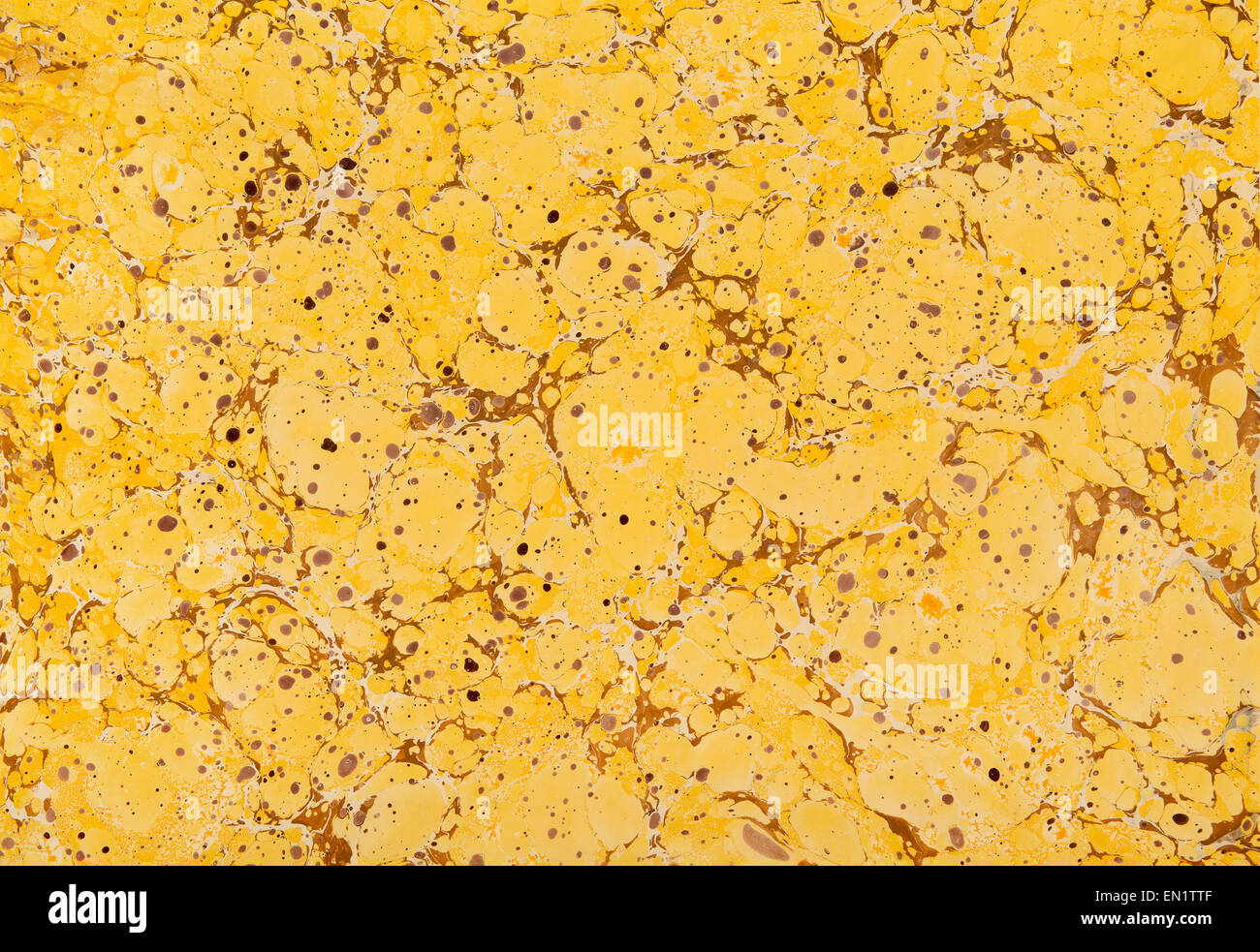 Yellow and brown marble paper in a full frame background Stock Photo