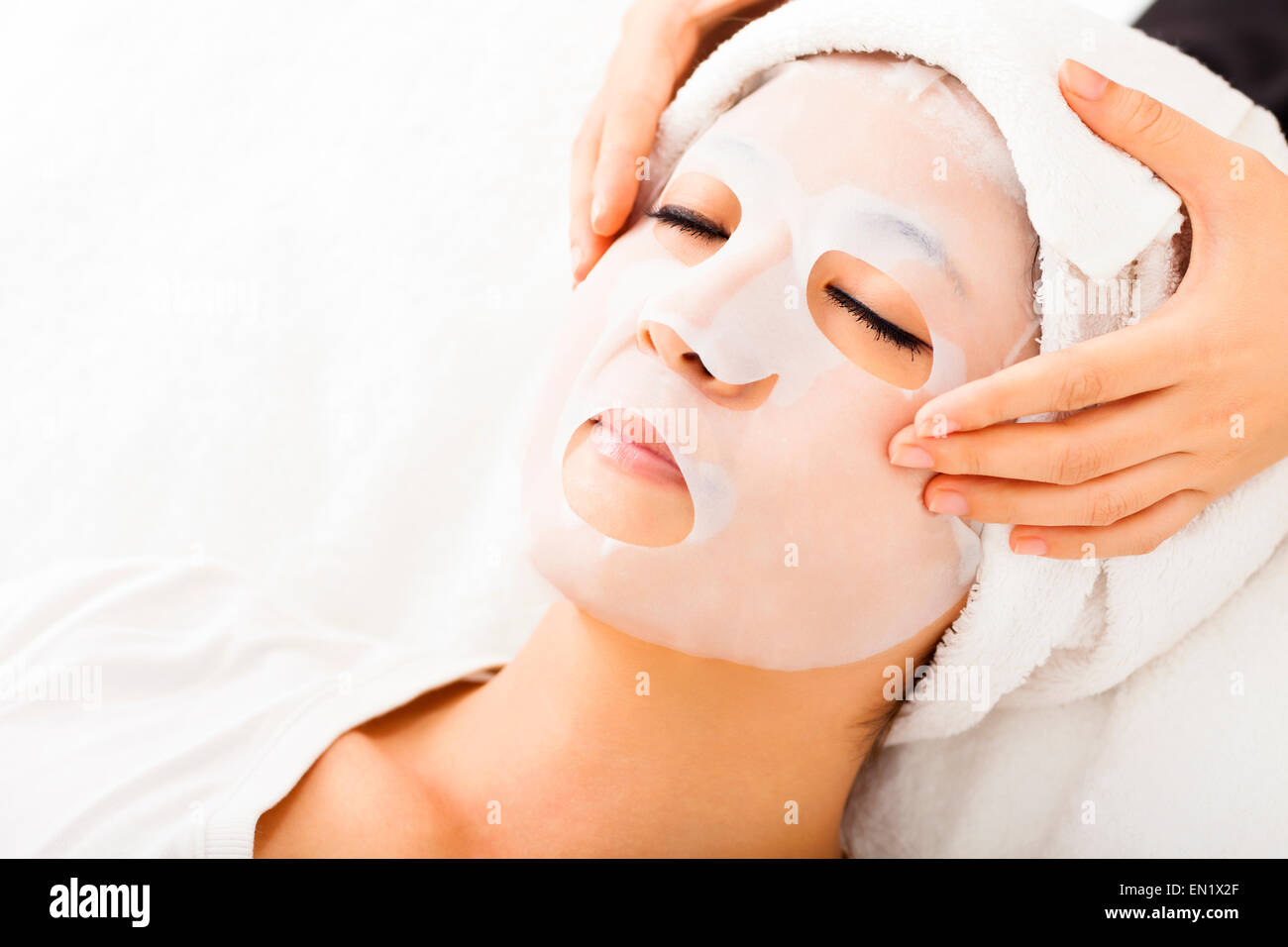 young lady with Facial mask at spa Stock Photo