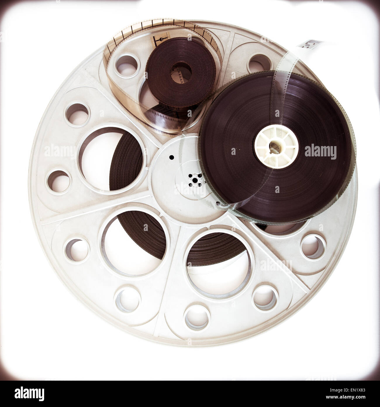 Original old big theater movie cinema 35mm loaded reel with film reels on  neutral background and vintage color effect Stock Photo - Alamy