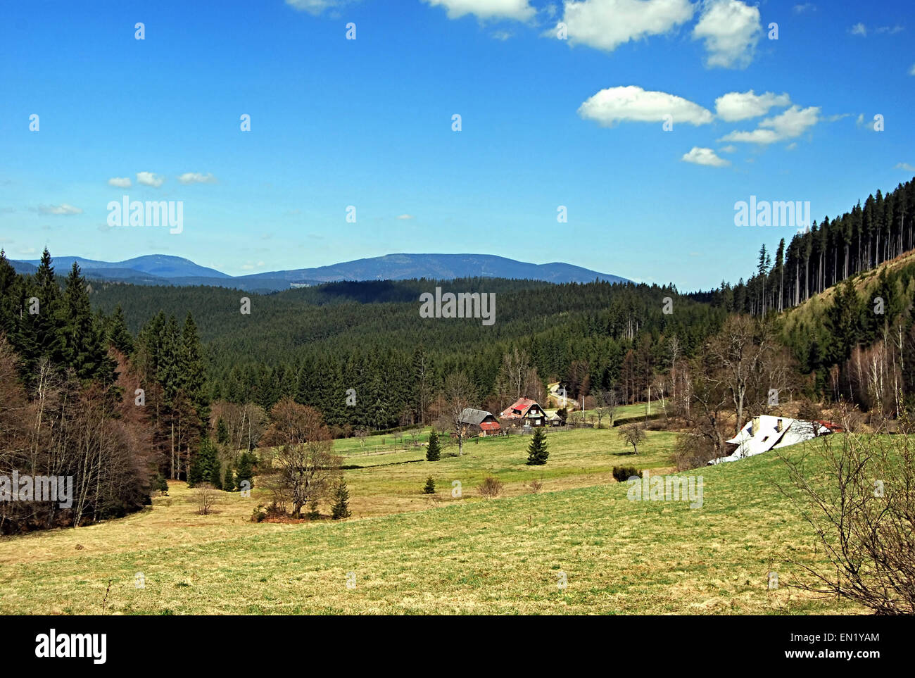 hamlets on meadow in Moravskoslezske Beskydy mountains with nice panorama of mountains Stock Photo