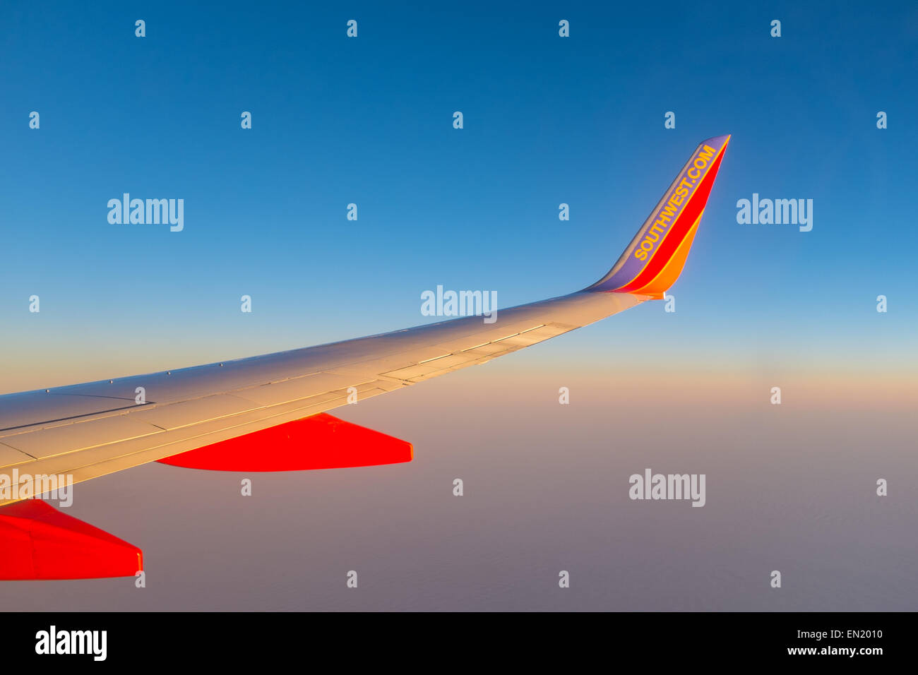 South west airlines aircraft wing set against a blue sky Stock Photo