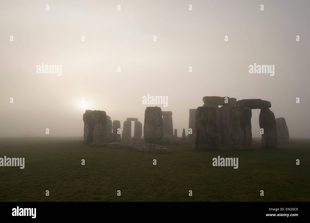 Dawn and Mist at Stonehenge, prehistoric monument of standing stones, Wiltshire, England. UNESCO World Heritage Site. Stock Photo