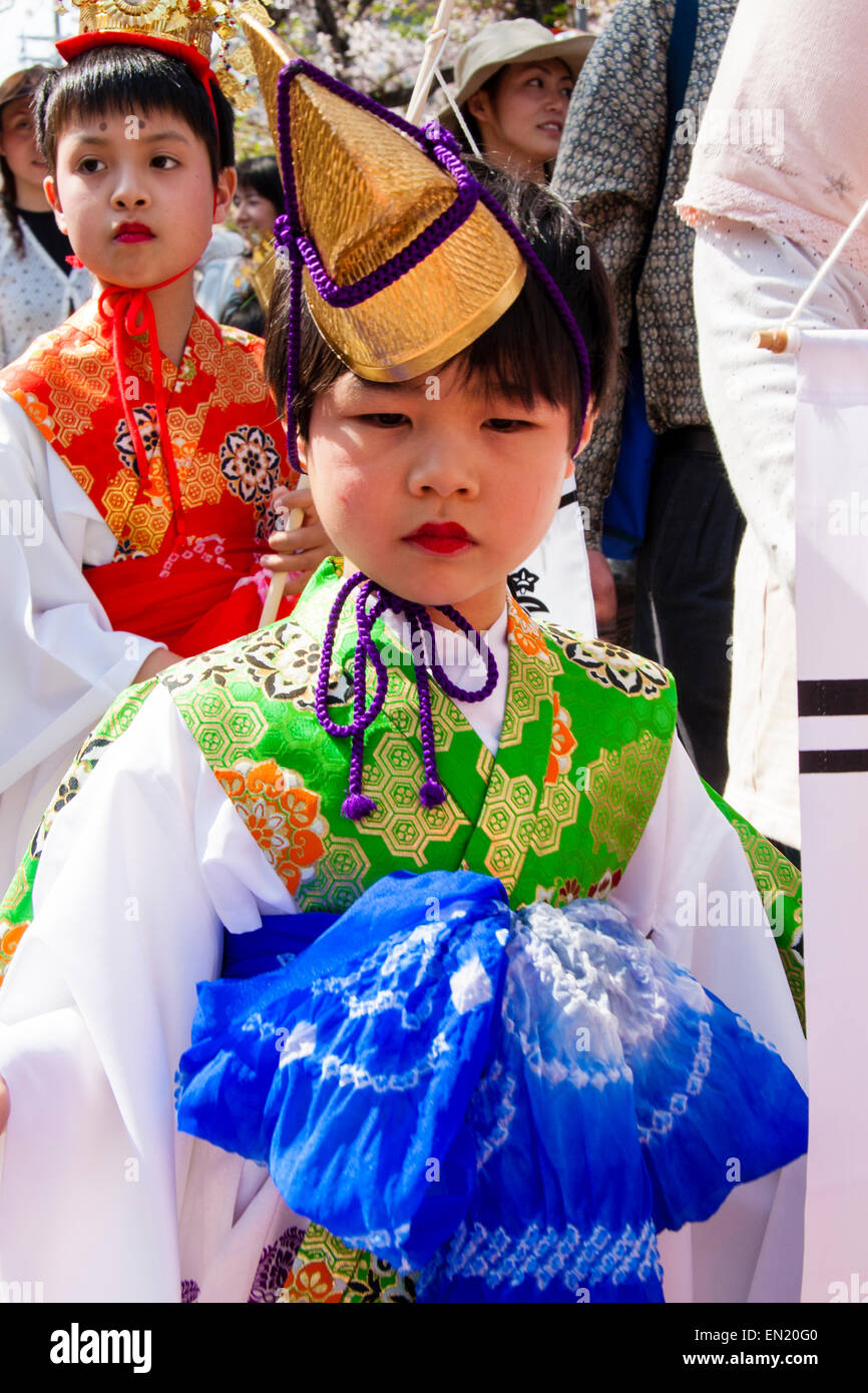 Japanese child, boy, 6-7 year old, walking towards viewer dressed as a Heian period courtier in the yearly Genji Parade at Tada, Kaswanishi, Japan. Stock Photo