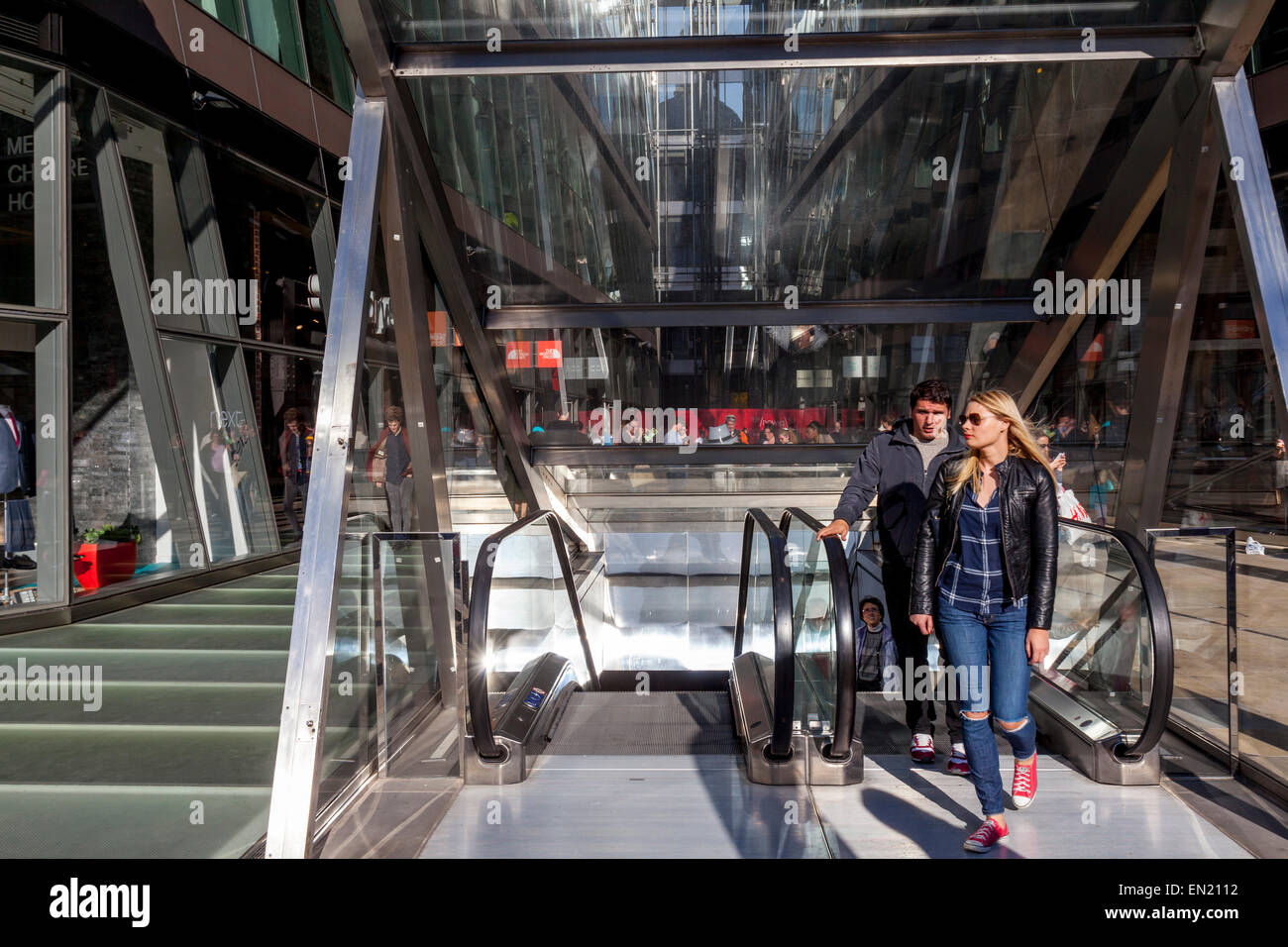 People Using The Escalators, One New Change Shopping Centre, Cheapside, London, England Stock Photo