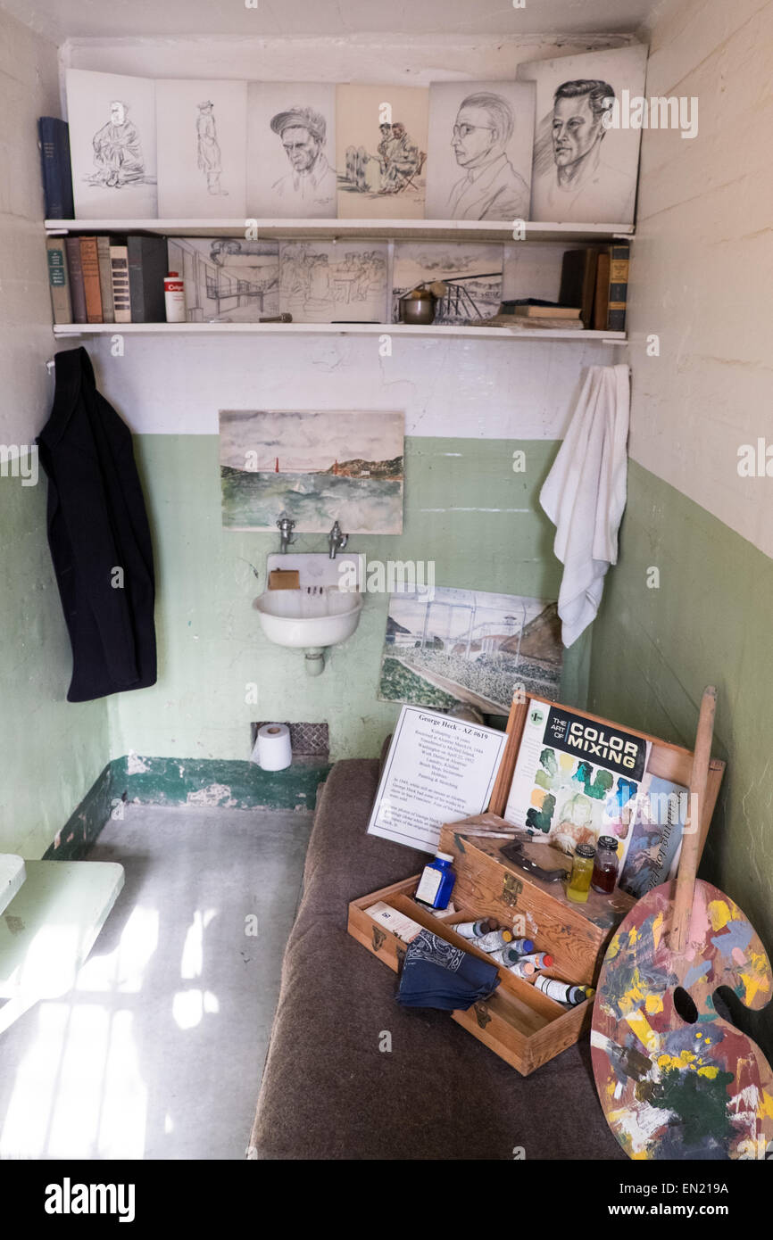 View of George Heck prison cell Alcatraz with some of his paintings drawings on show. Stock Photo