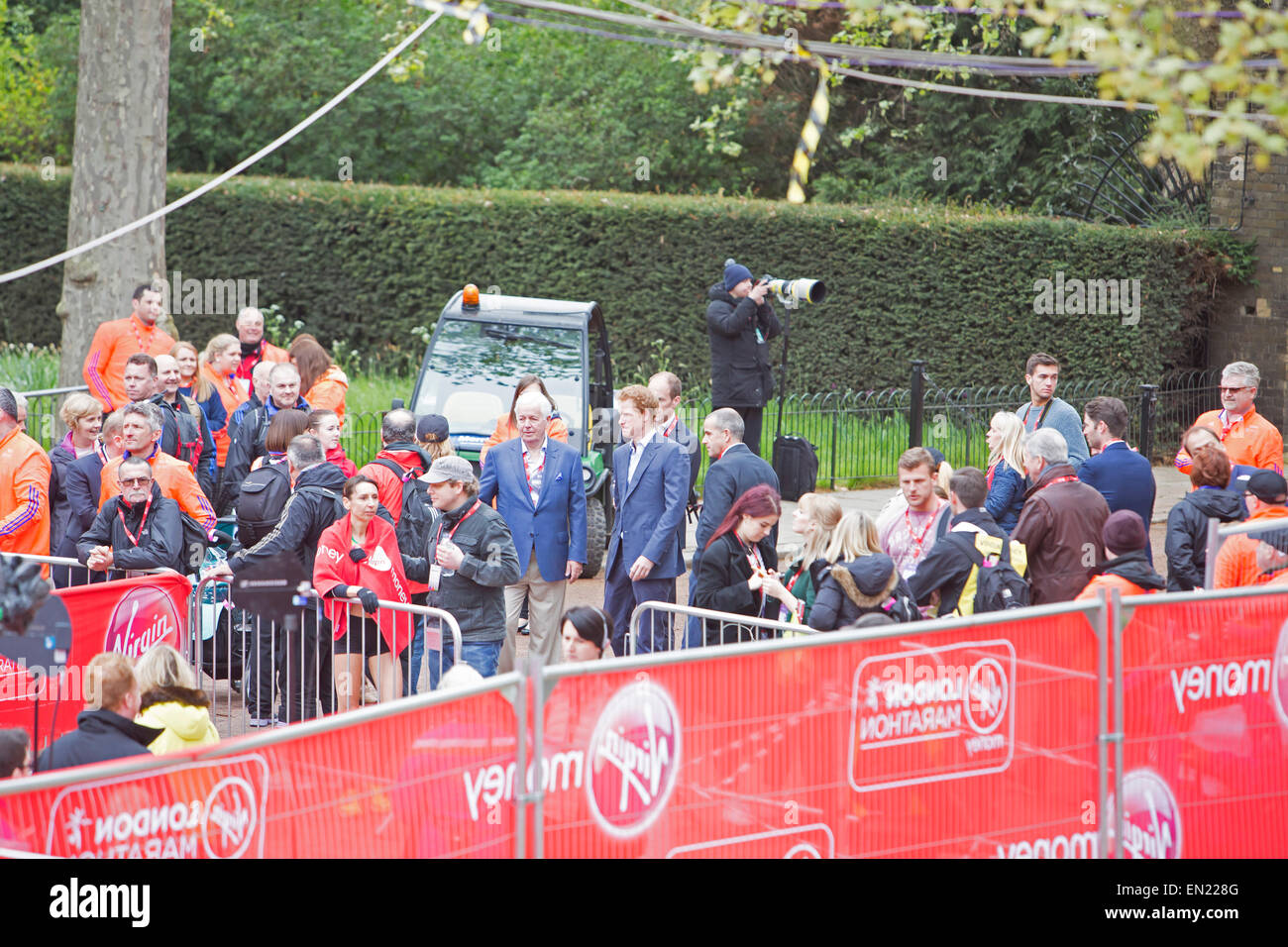 Prince Harry arrives at the finish line of the Virgin money London