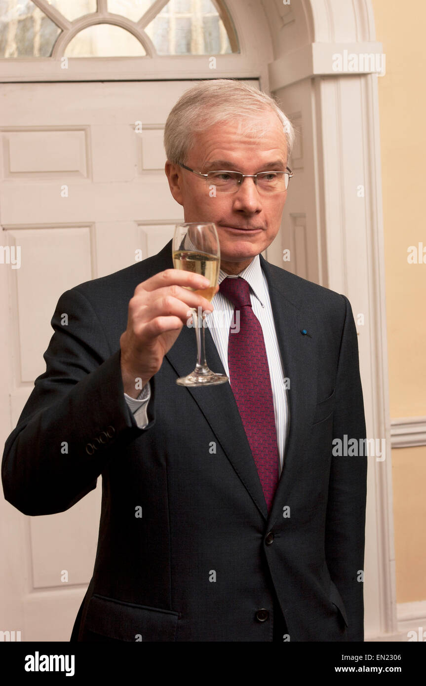 Bernard Emié raising a glass of champagne as a toast Stock Photo