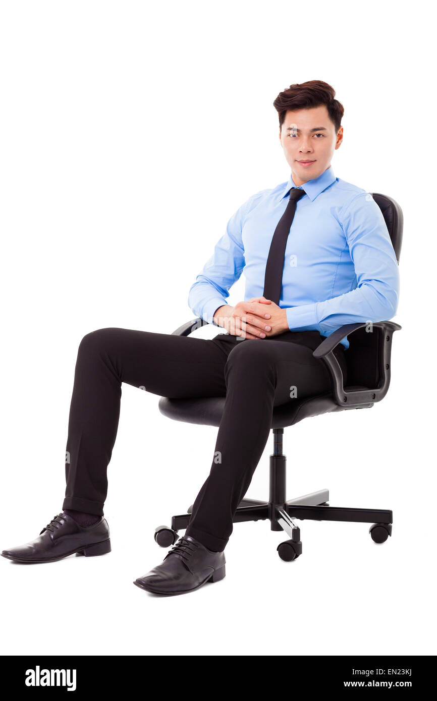 Young businessman sitting in a chair isolated Stock Photo