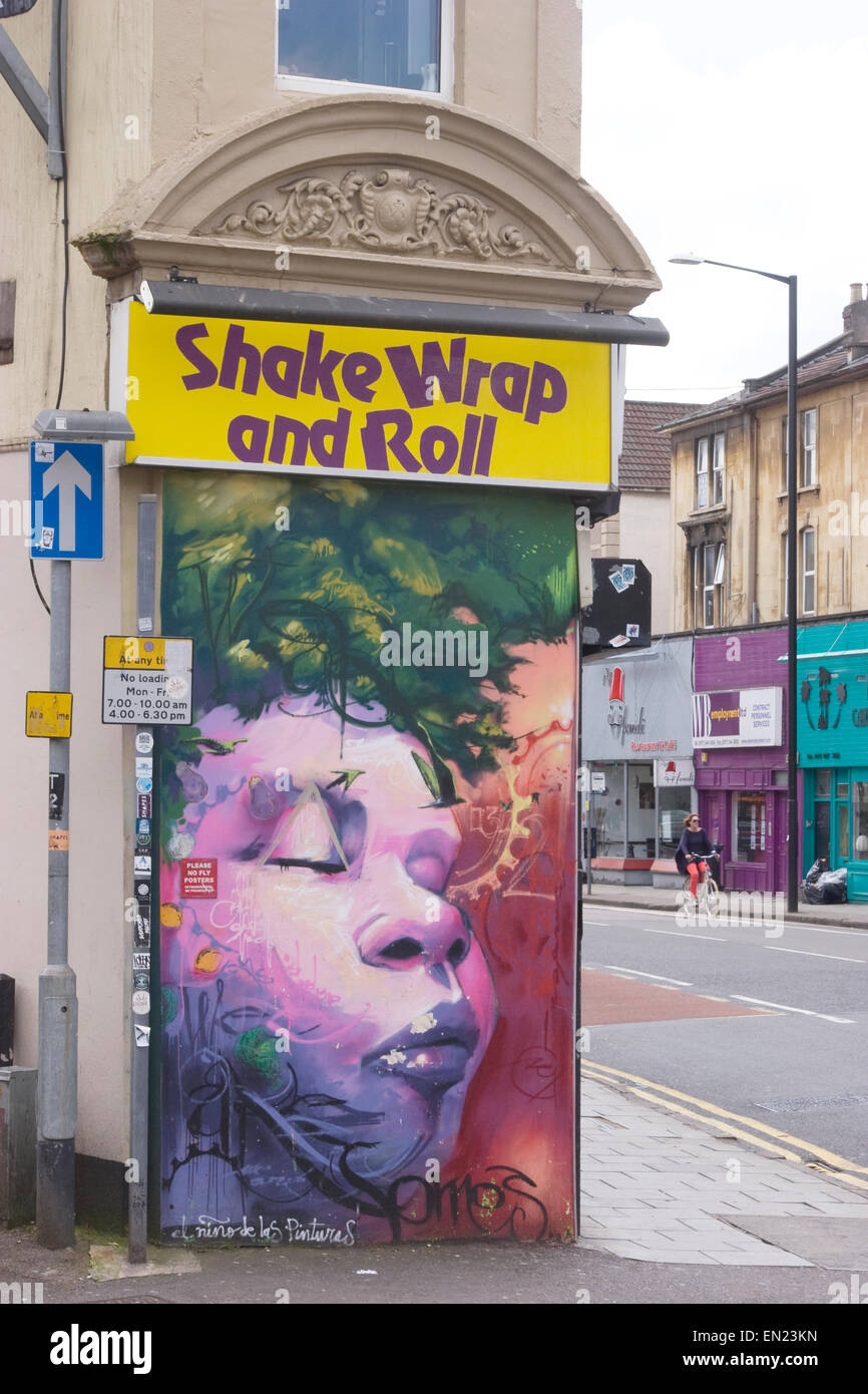 Street art outside 'Shake Wrap and Roll' snack shop, Gloucester Road, Bristol Stock Photo