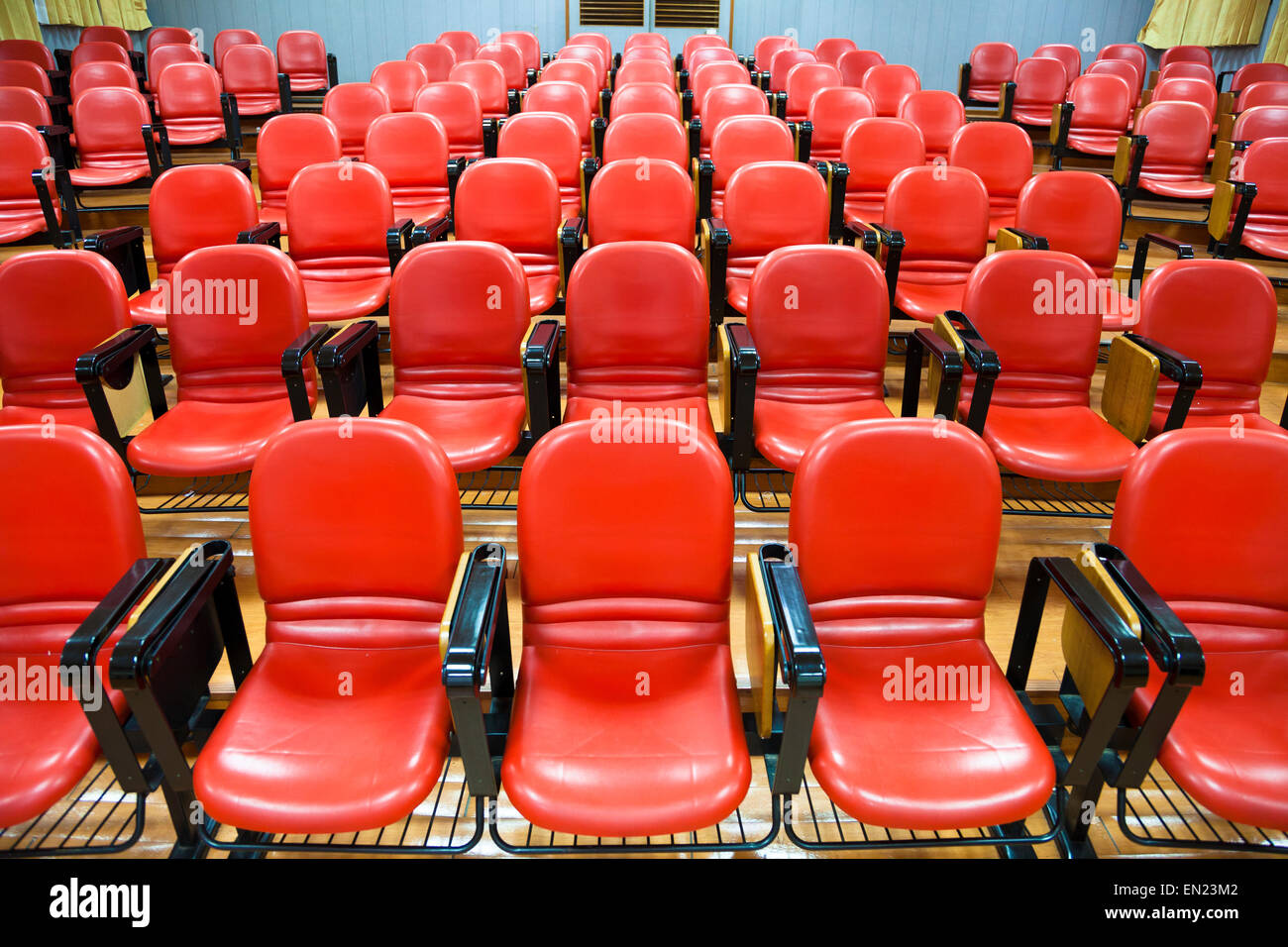 Interior of empty conference hall with red chairs Stock Photo