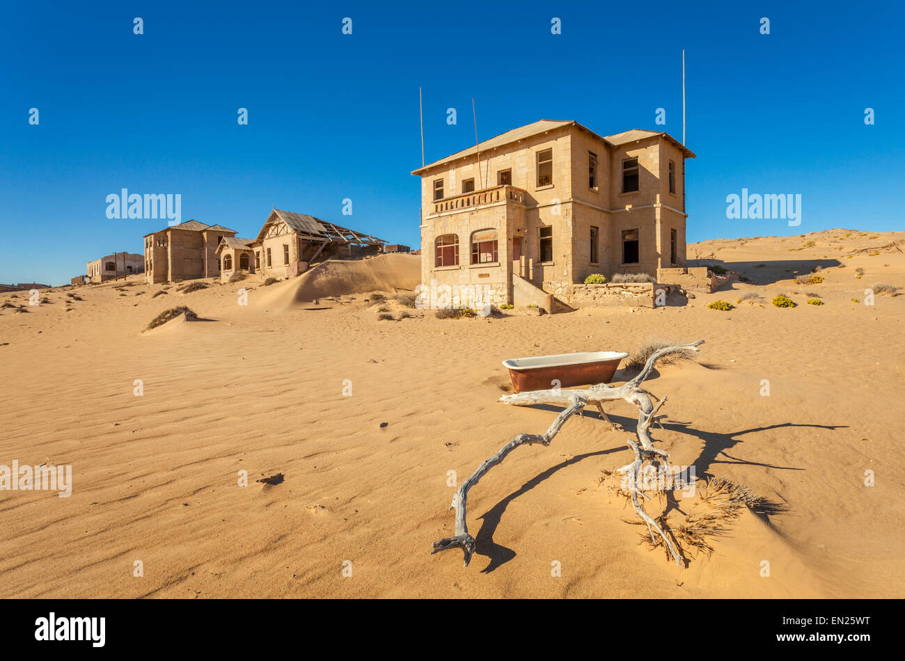 Deserted houses in Kolmanskop, a former diamond town in Namibia. Stock Photo