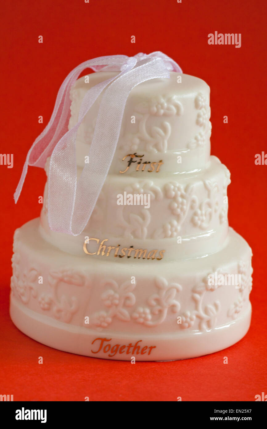 First Christmas Together wedding cake hanging ornament isolated on red background Stock Photo