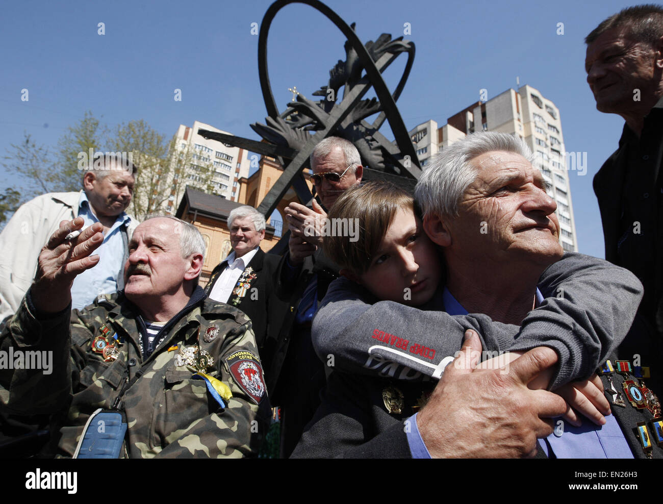 Kiev, Ukraine. 26th Apr, 2015. A former liquidators of the Chernobyl nuclear accident attends a commemoration ceremony at the Chernobyl victims' memorial in the Ukrainian capital of Kiev on April 26, 2015. The world marks the 29th anniversary of the world's worst nuclear disaster at Chernobyl nuclear pant in Ukraine. The explosion at reactor number four of the Chernobyl power plant in the early hours of April 26, 1986 sent radioactive fallout into the atmosphere that spread from the Soviet Union across Europe. © Serg Glovny/ZUMA Wire/ZUMAPRESS.com/Alamy Live News Stock Photo