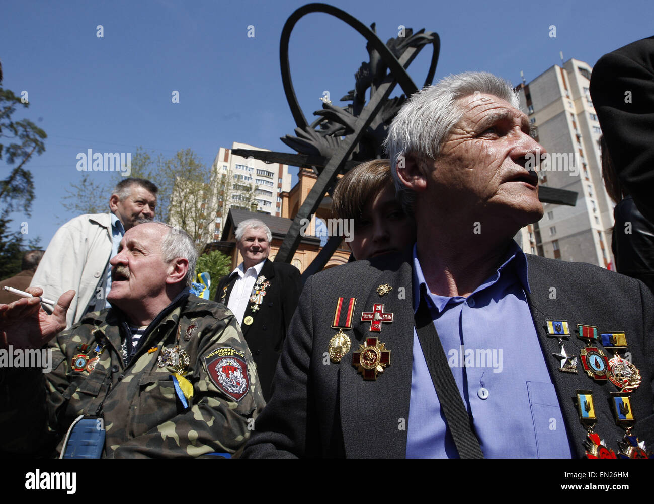 Kiev, Ukraine. 26th Apr, 2015. A former liquidators of the Chernobyl nuclear accident attends a commemoration ceremony at the Chernobyl victims' memorial in the Ukrainian capital of Kiev on April 26, 2015. The world marks the 29th anniversary of the world's worst nuclear disaster at Chernobyl nuclear pant in Ukraine. The explosion at reactor number four of the Chernobyl power plant in the early hours of April 26, 1986 sent radioactive fallout into the atmosphere that spread from the Soviet Union across Europe. © Serg Glovny/ZUMA Wire/ZUMAPRESS.com/Alamy Live News Stock Photo