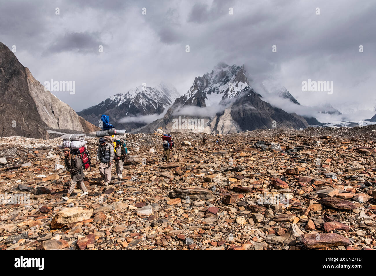 Mountains and Faces; Trekking in the Karakoram Mountains Stock Photo