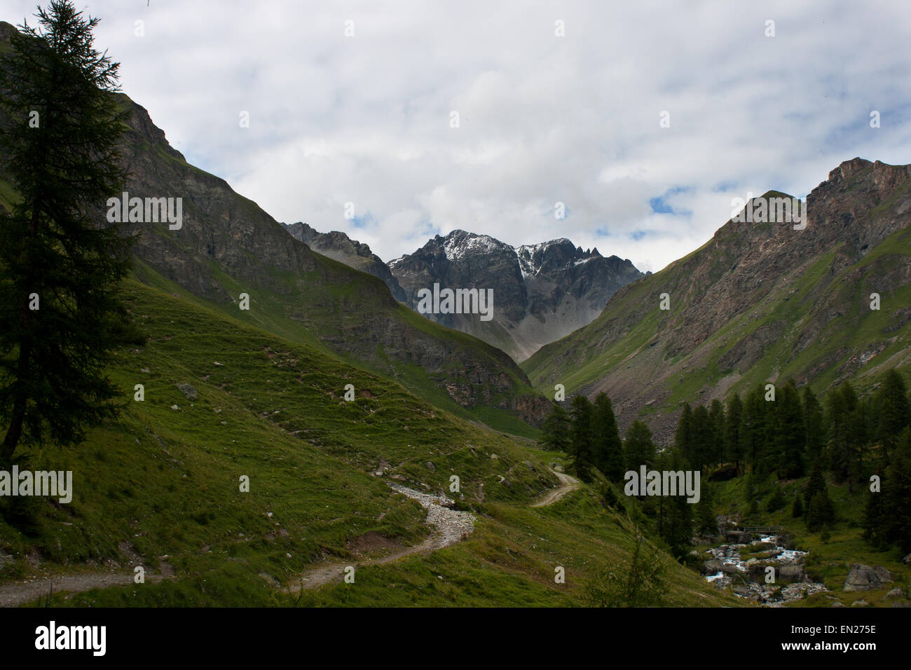 Piz Blaisch Lunga, Val Tasna, Switzerland Engadin Alps Scuol Ardez walking path in a valley towards mountain peak Stock Photo