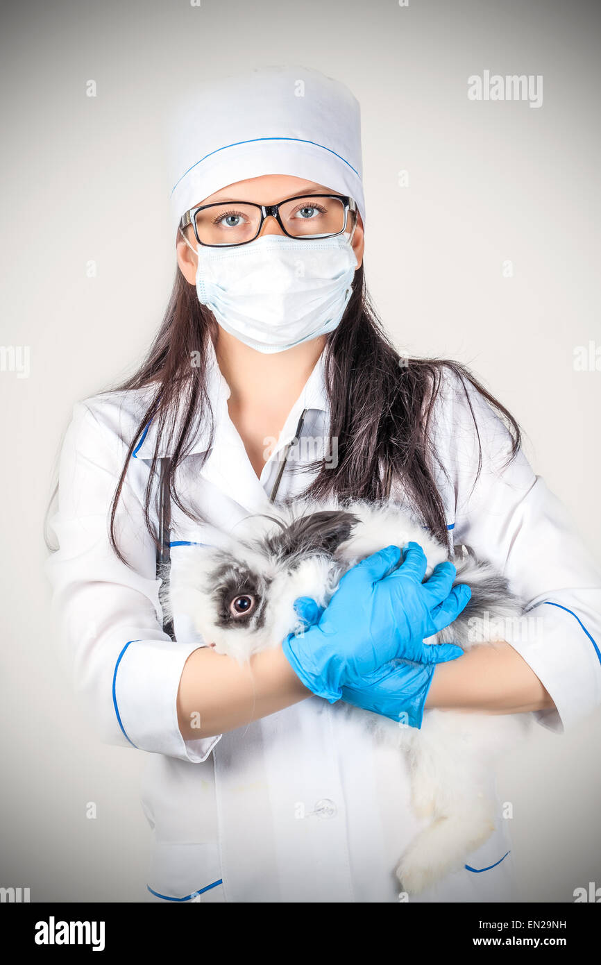 portrait of a doctor with a decorative rabbit in hands Stock Photo