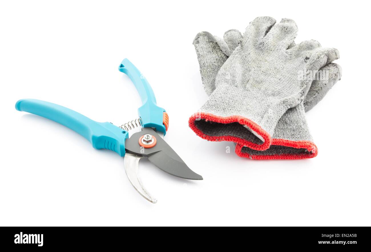 Pruning shears and worn gardening gloves isolated on white background Stock Photo