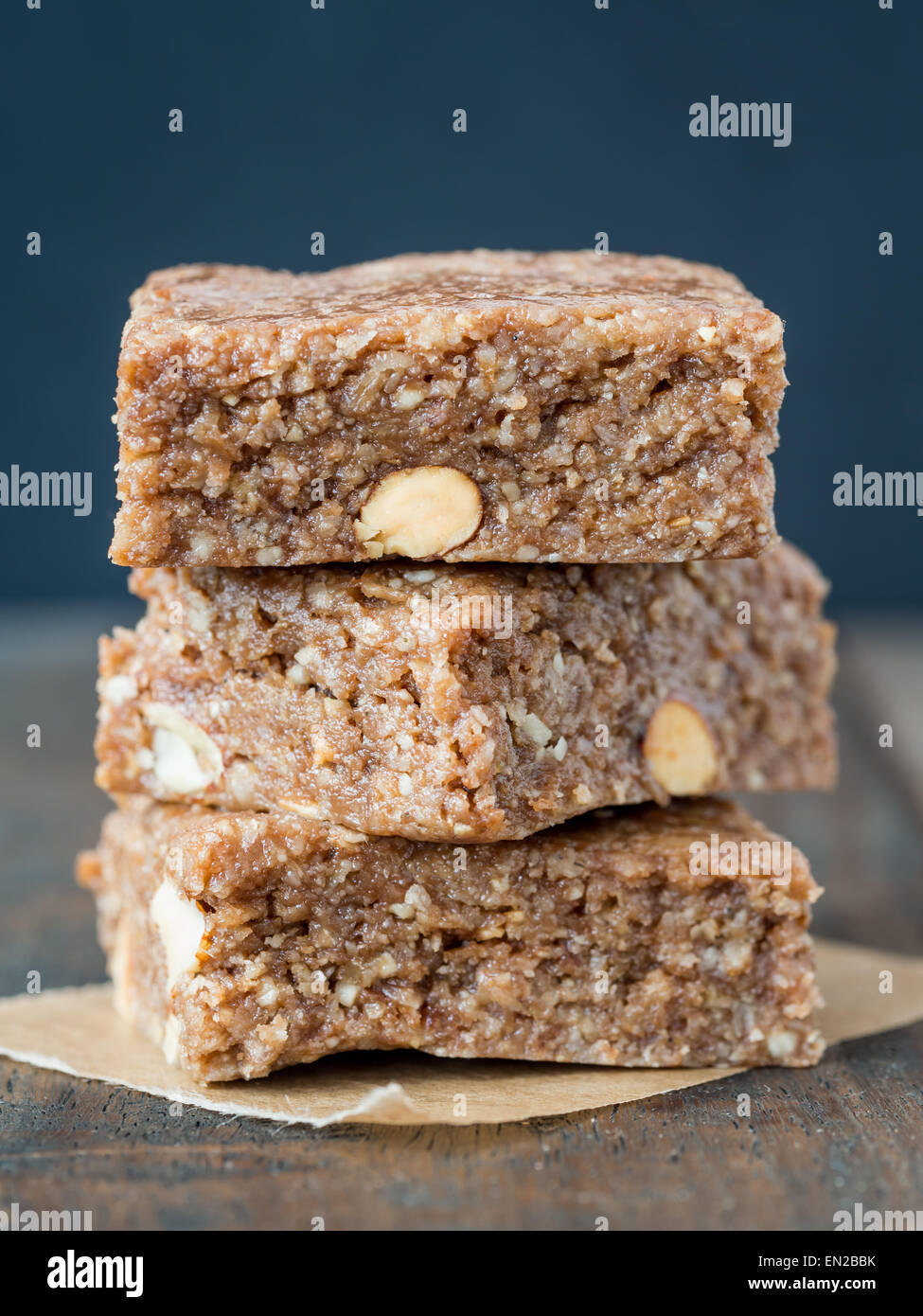 Homemade organic healthy chewy muesli granola power bars with wholemeal oats, cashew butter, honey and nuts, cut into bite size. Stock Photo