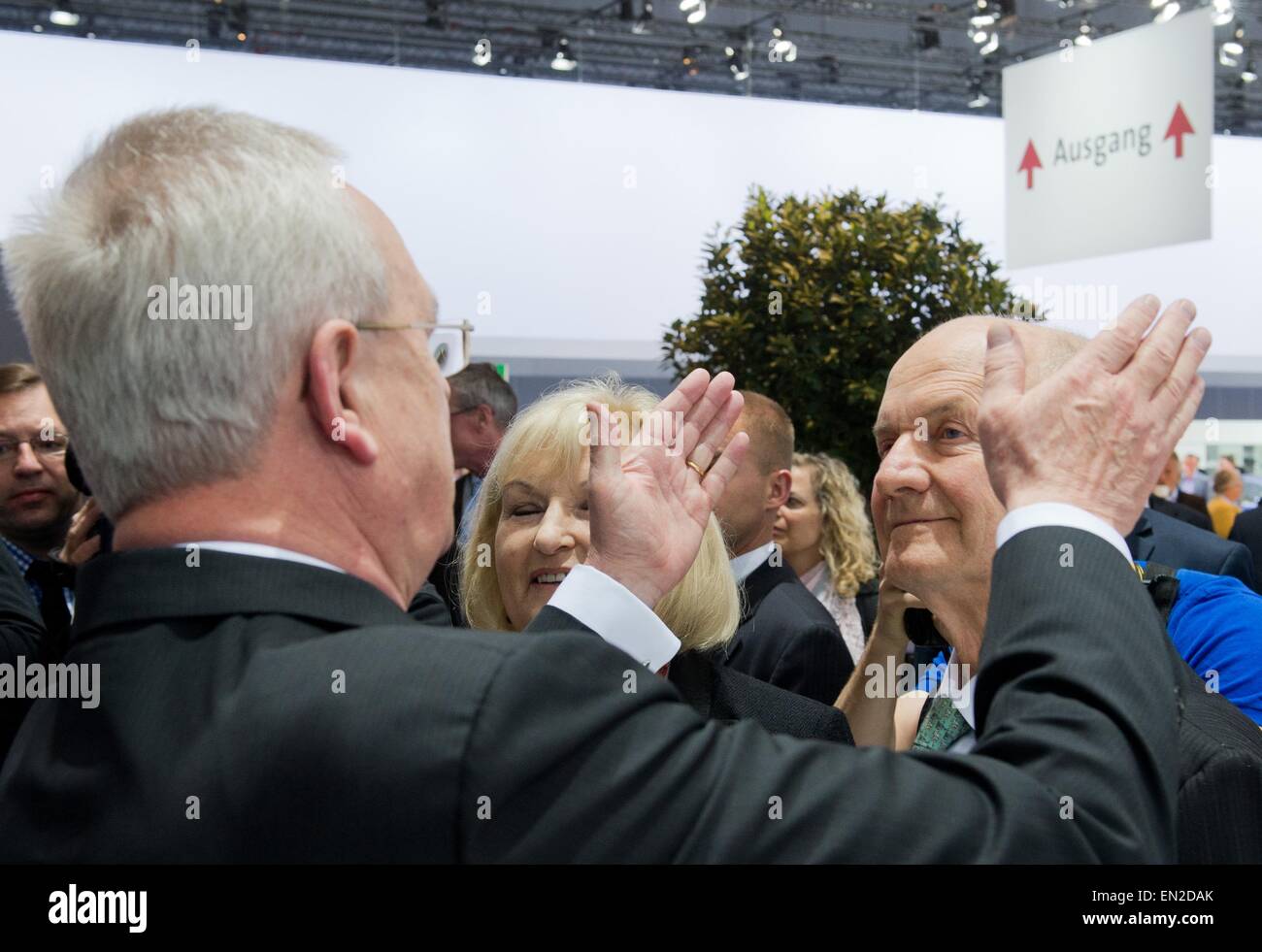 Chairman of the supervisory board of Volkwagen AG, Ferdinand Piech (R), his wife and VW supervisory board member, Ursula Piech (C), stand before the start of the Volkswagen AG general meeting, while Volkswagen CEO Martin Winterkorn gestures towards the exit sign, in Hanover, Germany, 25 April 2015. Photo: JULIAN STRATENSCHULTE/dpa Stock Photo