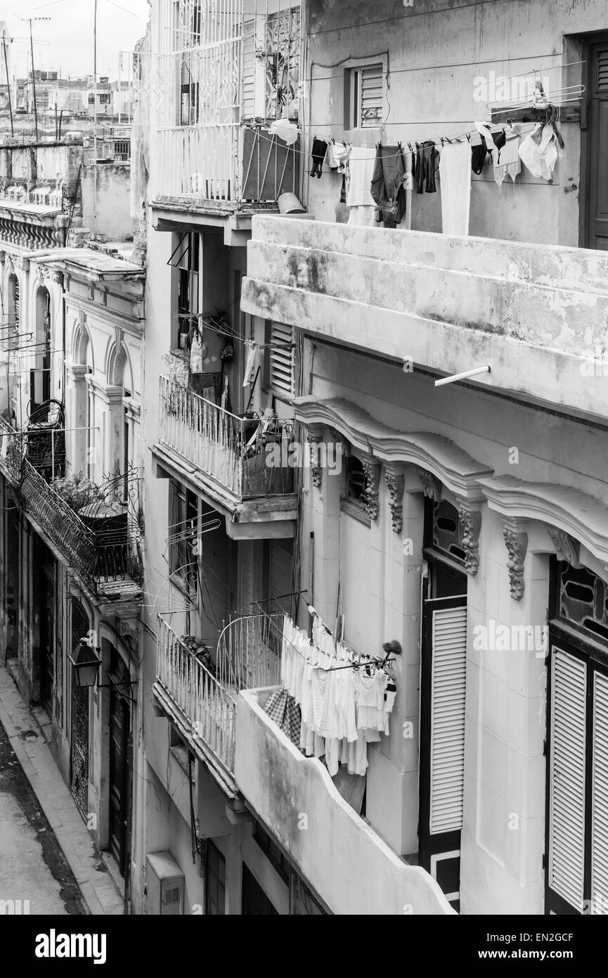 Clothes hanging on clotheslines on balconies of dilapidated old