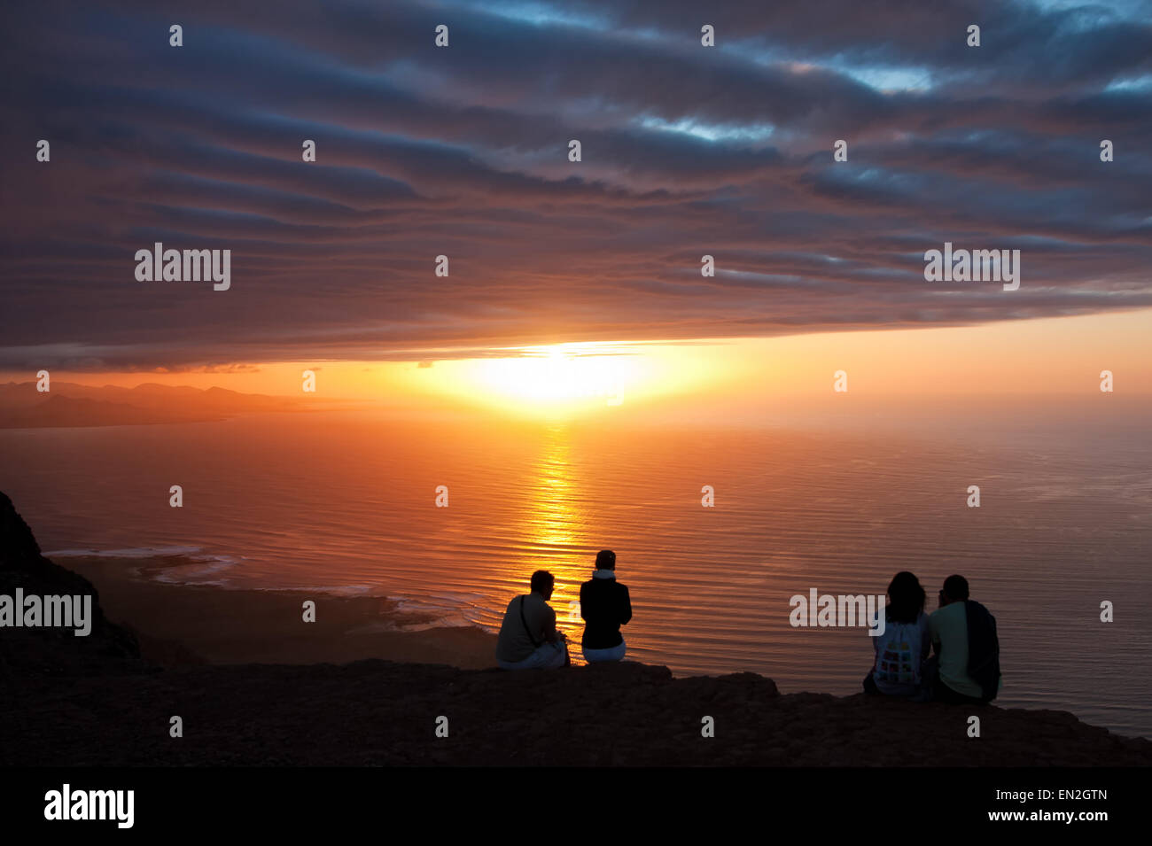 Lanzarote, backlit people at sunset Stock Photo