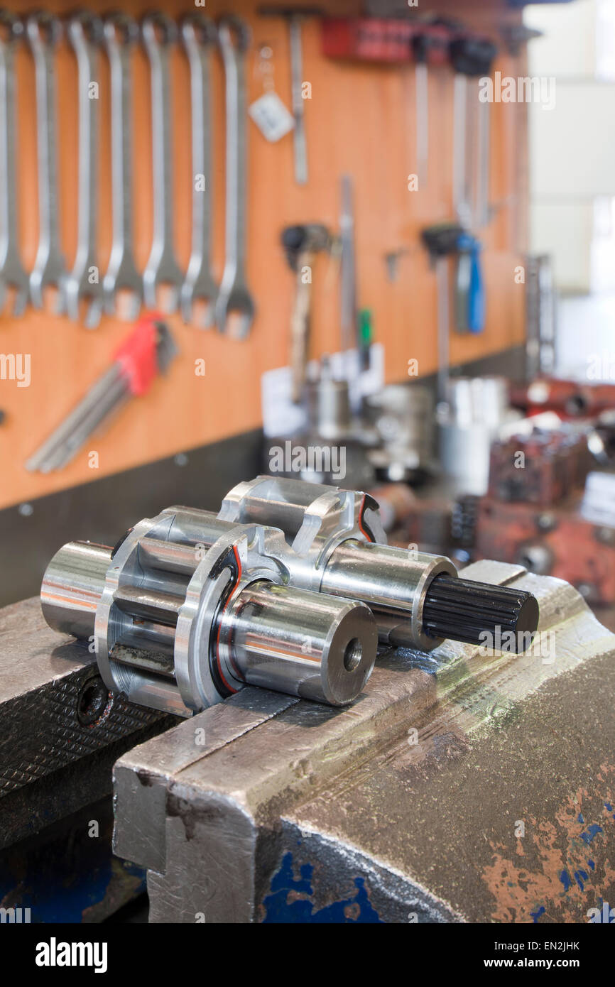 Parts of hydraulic pumps in workshop Stock Photo
