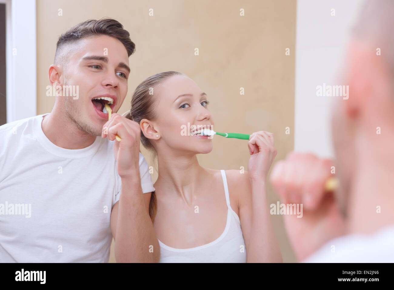 Young beautiful couple cleaning teeth Stock Photo Alamy