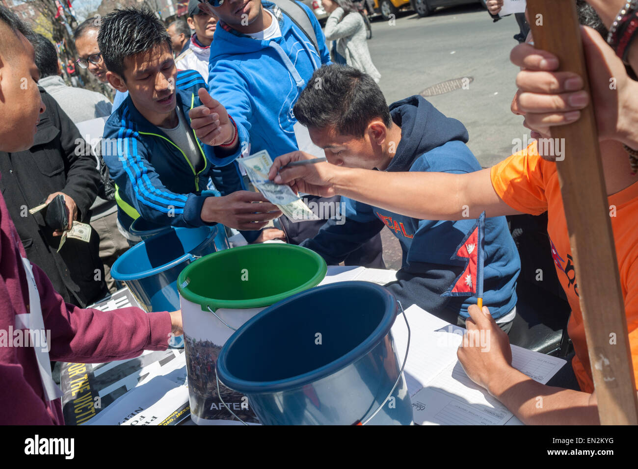 Jackson Heights, New York, USA. 26th Apr, 2015. Members of the Nepalese community in Jackson Heights in New York collect money for victims of the Nepalese earthquake, on Sunday, April 26, 2015. Jackson Heights has a sizable Nepalese community with many members worried about the whereabouts and safety of family and friends. Over 2500 people have died in the massive earthquake. Credit:  Richard Levine/Alamy Live News Stock Photo