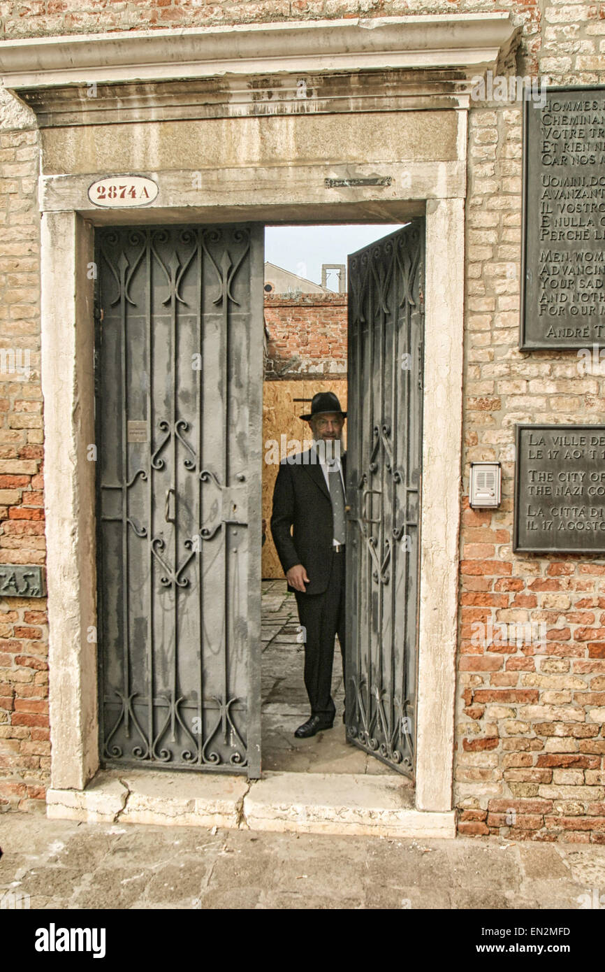 Venice, Province of Venice, ITALY. 7th Oct, 2004. In the Campo del Ghetto Nuovo, the main square of the present-day Venetian Ghetto, a bearded Orthodox Jewish man opens the door to the community's Jewish home for the aged-Casa di Riposo Israelitica. Venice, a UNESCO World Heritage Site, is one of the most popular international tourist destinations. © Arnold Drapkin/ZUMA Wire/Alamy Live News Stock Photo