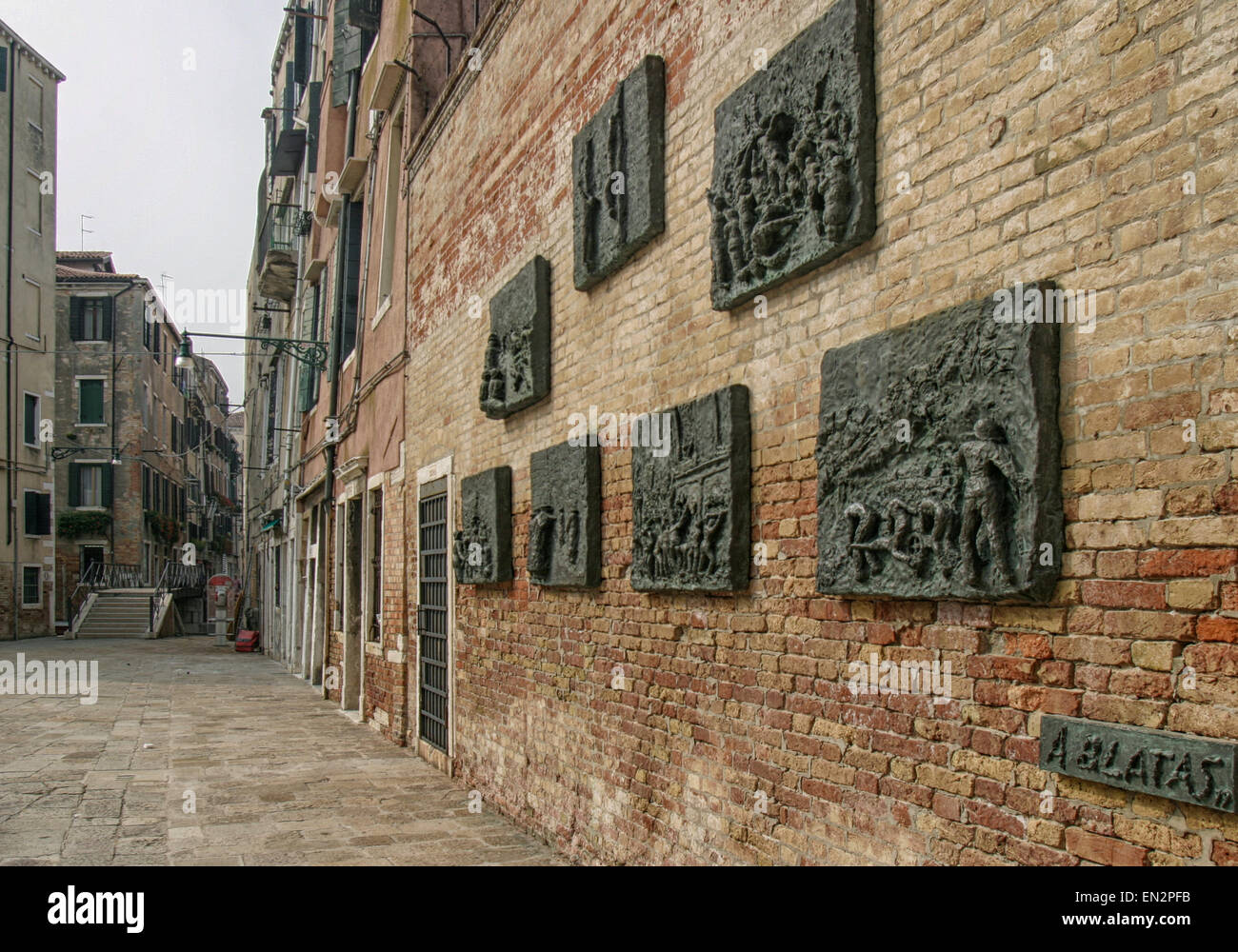 Venice, Province of Venice, ITALY. 7th Oct, 2004. In 1979 Arbit Blatas, a Lithuanian-born artist who lost his mother in the Holocaust, created this seven-panel bronze bas-relief Holocaust memorial, by the request of the Jewish Community of Venice. On a wall of the Campo del Nuovo Ghetto, it commemorates the night of Dec. 5, 1943, when the first 200 of the city's Jews were rounded up and marched out for deportation and death. Venice, a UNESCO World Heritage Site, is one of the most popular international tourist destinations. © Arnold Drapkin/ZUMA Wire/Alamy Live News Stock Photo