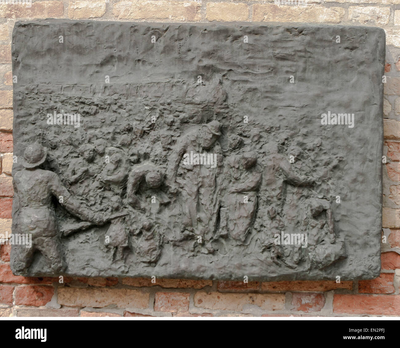 Venice, Province of Venice, ITALY. 7th Oct, 2004. A panel depicting Deportation, part of a seven-panel bronze bas-relief Holocaust memorial, on a wall of the Campo del Nuovo Ghetto by Arbit Blatas, a Lithuanian-born artist who lost his mother in the Holocaust. It commemorates the night of Dec. 5, 1943, when the first 200 of the city's Jews were rounded up and marched out for deportation and death. Venice, a UNESCO World Heritage Site, is one of the most popular international tourist destinations. © Arnold Drapkin/ZUMA Wire/Alamy Live News Stock Photo