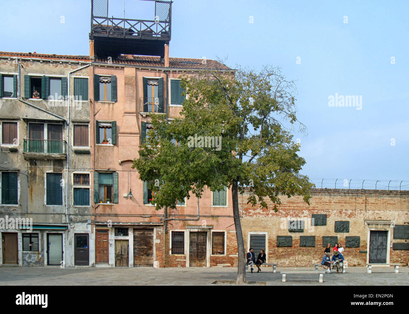 Venice, Province of Venice, ITALY. 7th Oct, 2004. A view of part of the Campo del Nuovo Ghetto, the main square of the present-day Venetian Ghetto. At right is Holocaust Memorial that commemorates the night of Dec. 5, 1943, when the first 200 of the city's Jews were rounded up and marched out for deportation and death. Venice, a UNESCO World Heritage Site, is one of the most popular international tourist destinations. © Arnold Drapkin/ZUMA Wire/Alamy Live News Stock Photo