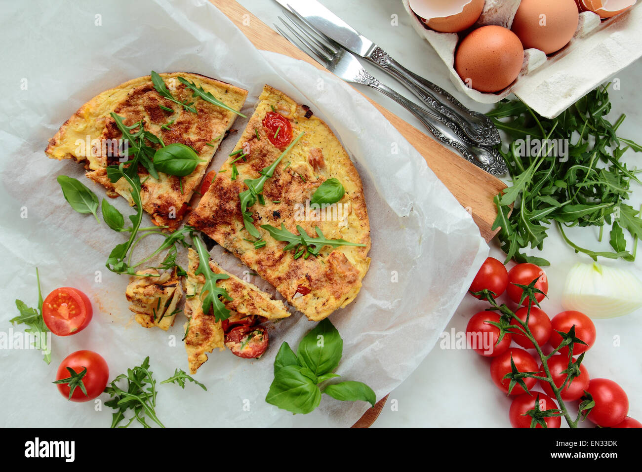 Omelet with fresh rucola salad and tomatoes Stock Photo