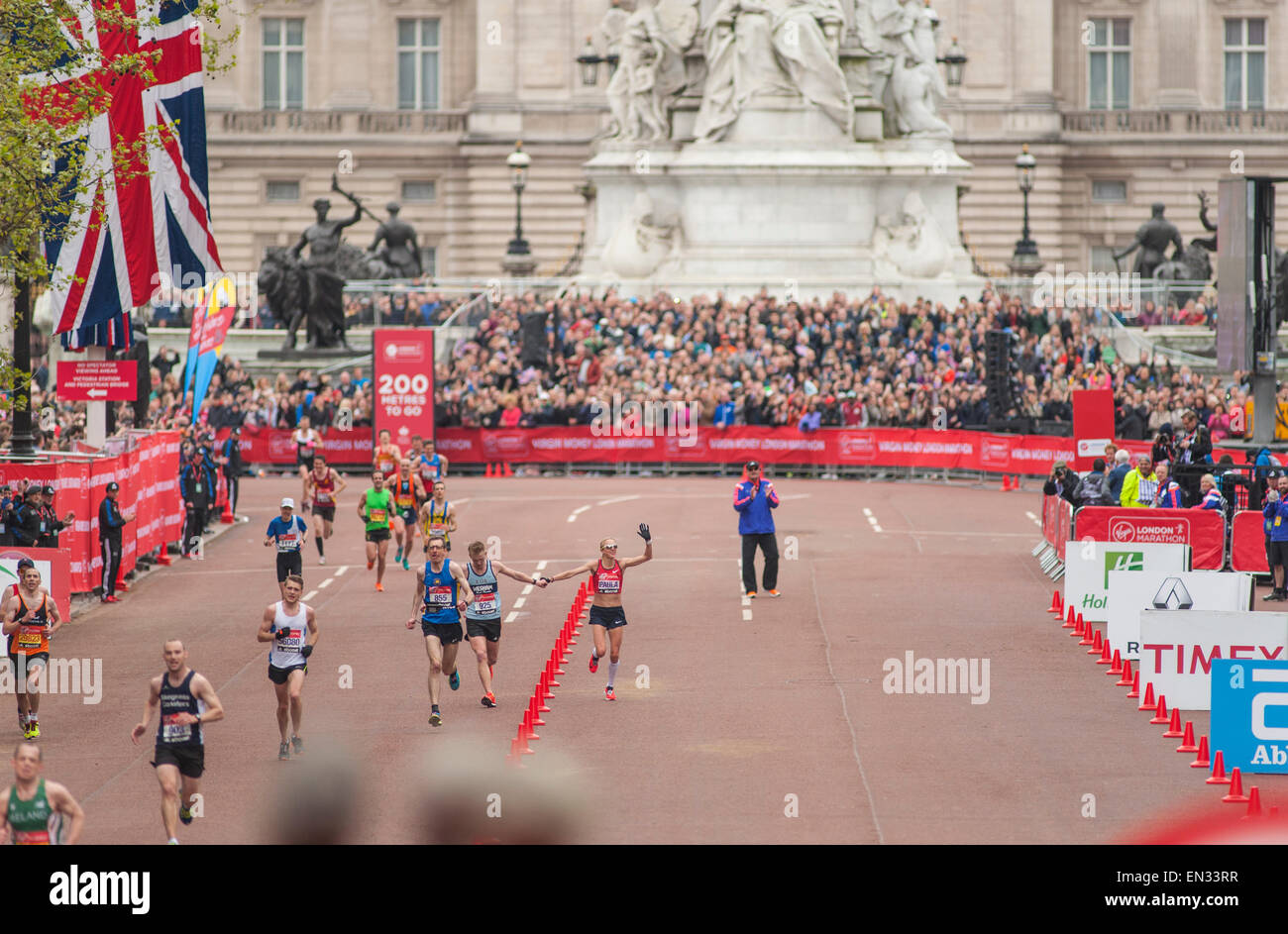 Paula Radcliffe on The Mall waving to the crowds as she finishes the Virgin Money London Marathon 2015 Stock Photo