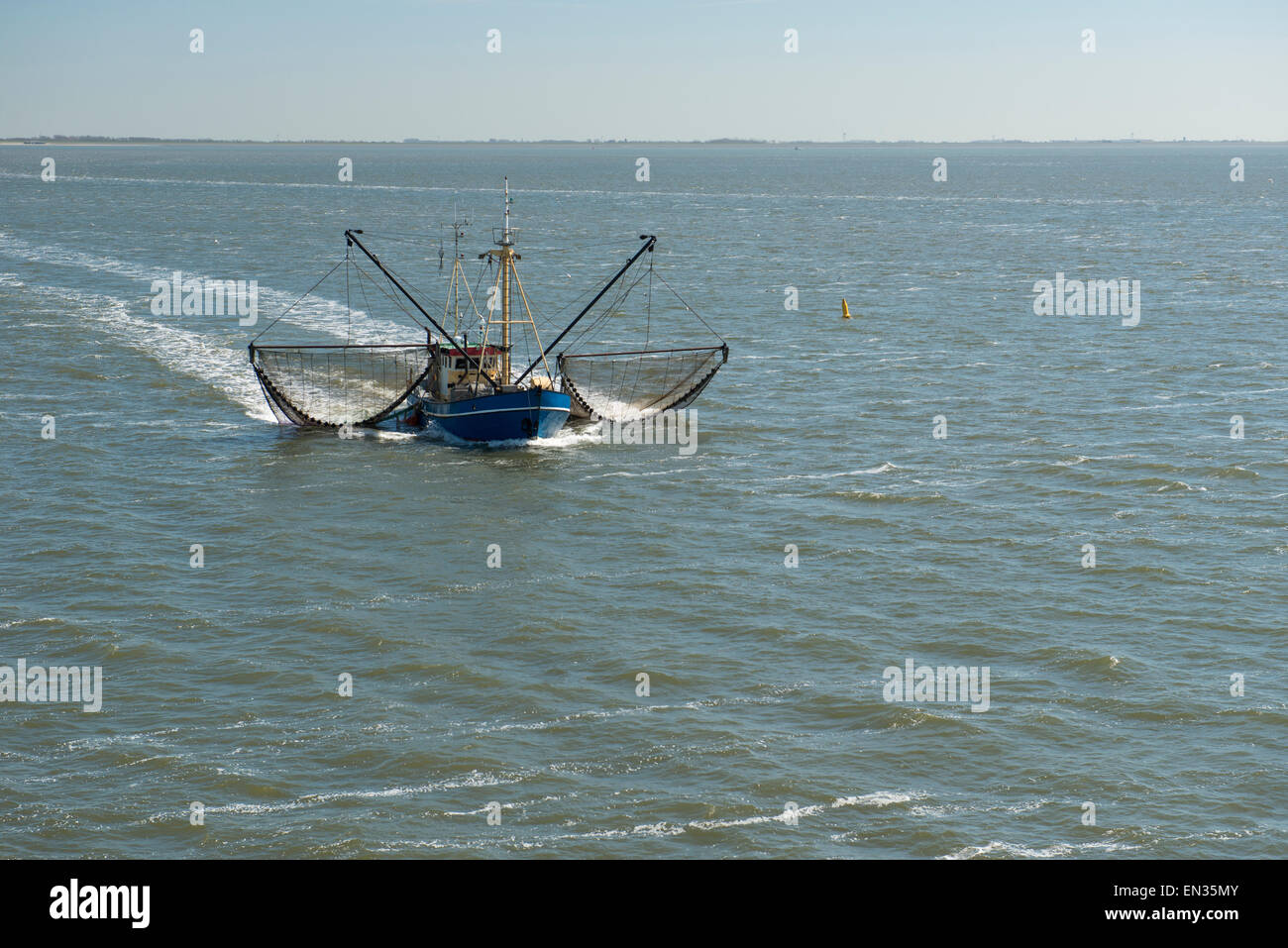 Fishing boat on the UNESCO protected Dutch Wadden Sea Stock Photo