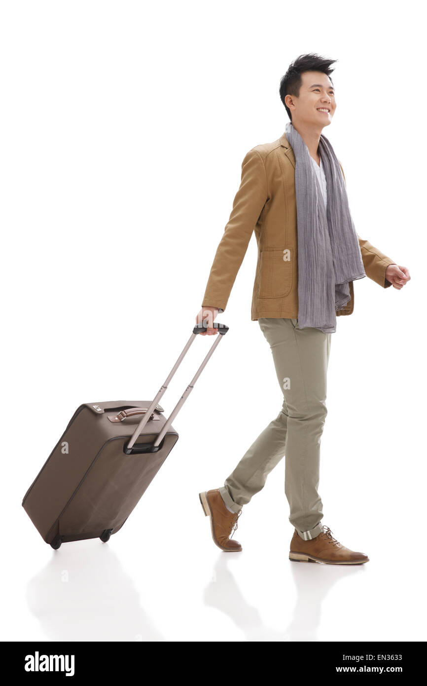 The young man took the suitcase travel Stock Photo Alamy