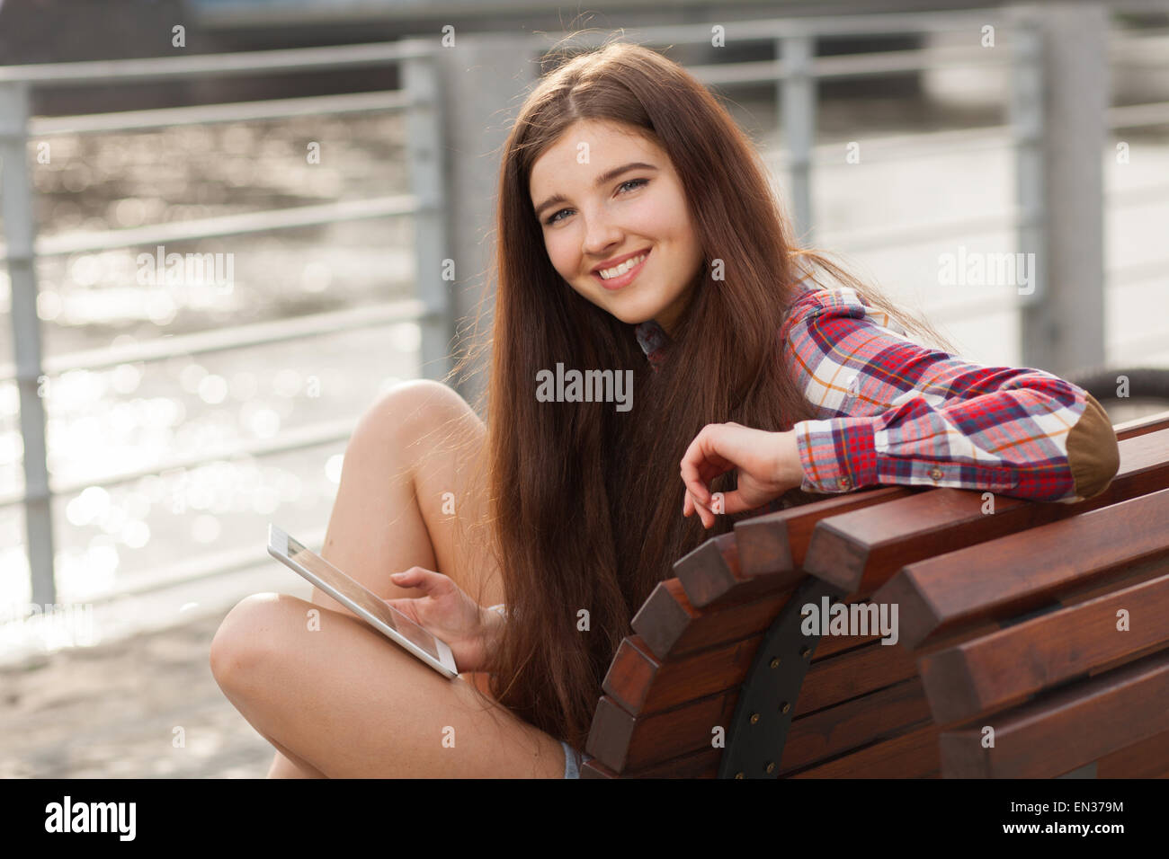 Face portrait of young woman using a tablet pc Stock Photo