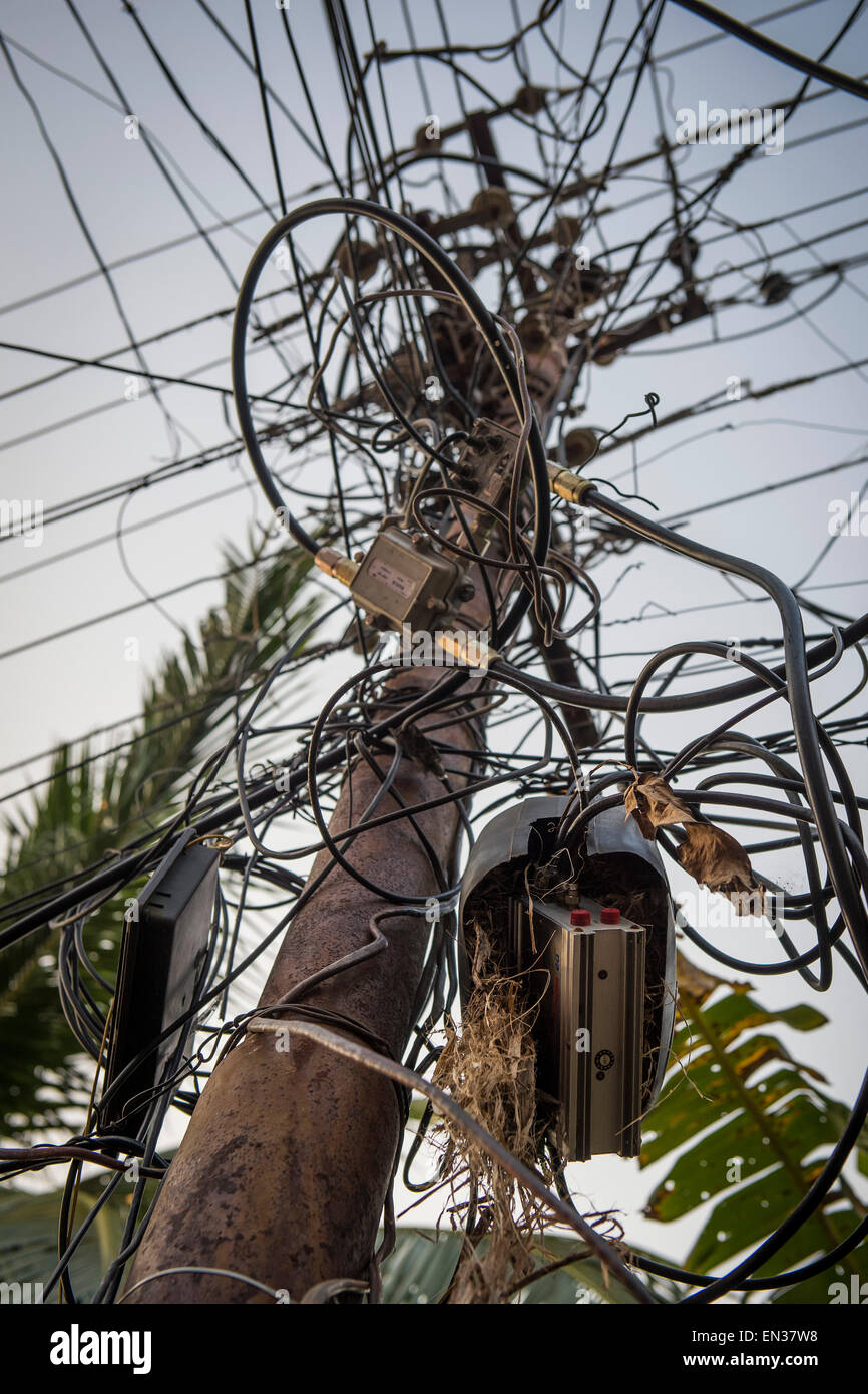 Electrical cables, tangled wires on a pylon, Kochi, Cochin, Kerala, India Stock Photo