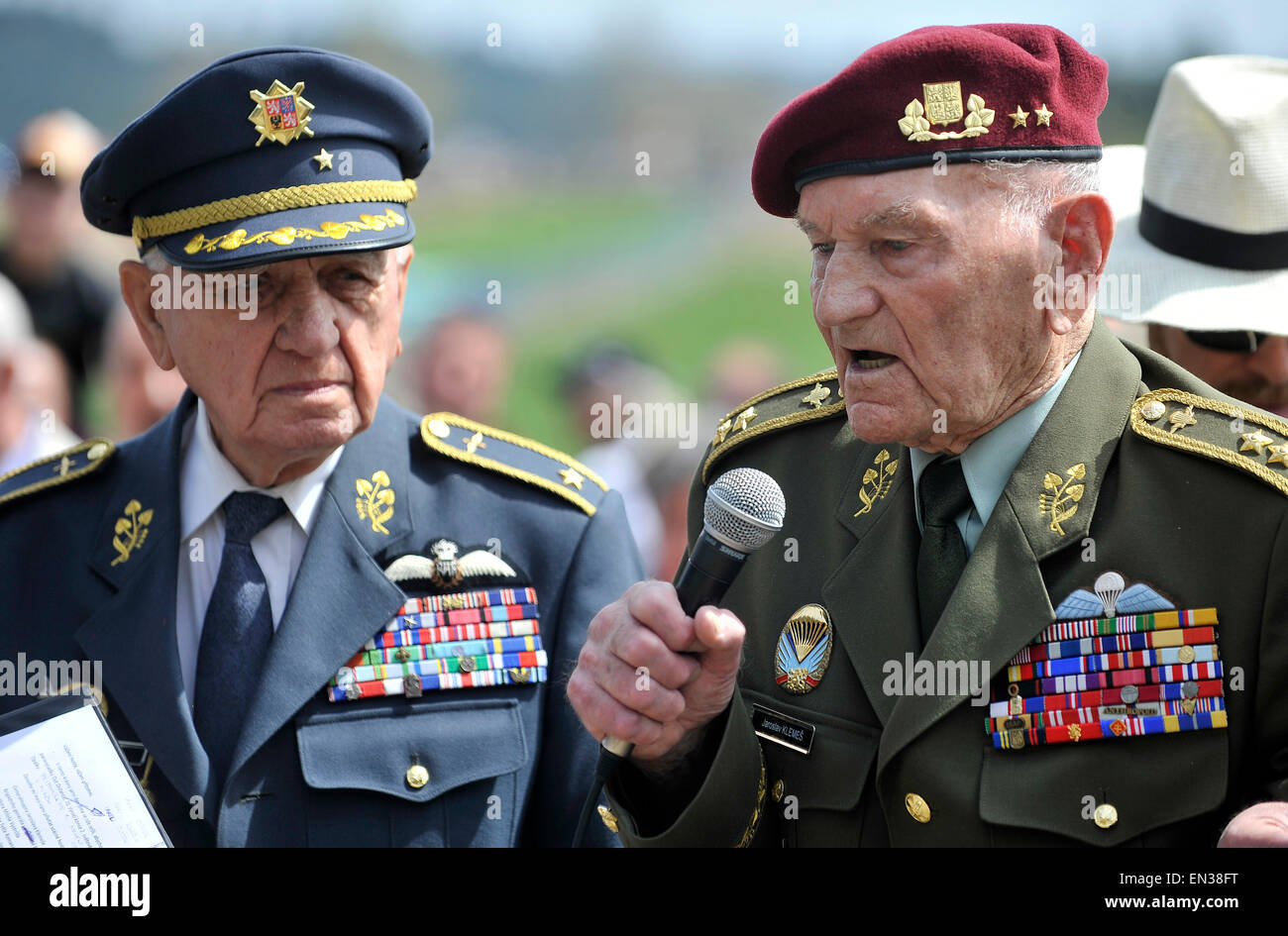 Orechov, Czech Republic. 25th Apr, 2015. About thousand people meet to commemorate wartime pilot Adolf Opalka on the occasion of his 100th birth anniversary and 73th anniversary of his parachute group Out Distance's operation participating in attack on Deputy Reichsprotektor Reinhard Heydrich and at the same time 70th anniversary of end of World War II, at the memorial in Orechov, Czech Republic, April 25, 2015. In the picture is Emil Bocek (left) one of the last living pilots of British Royal Air Force (RAF) and speaking Jaroslav Klemes, the last living parachutist landed in protectorate. (CT Stock Photo