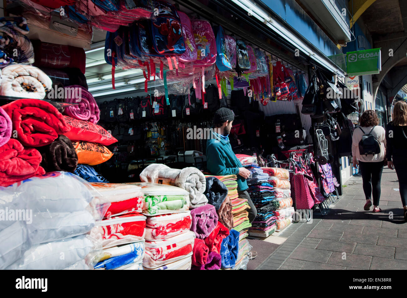 Brixton shop trader selling everything under railway arches in Railton